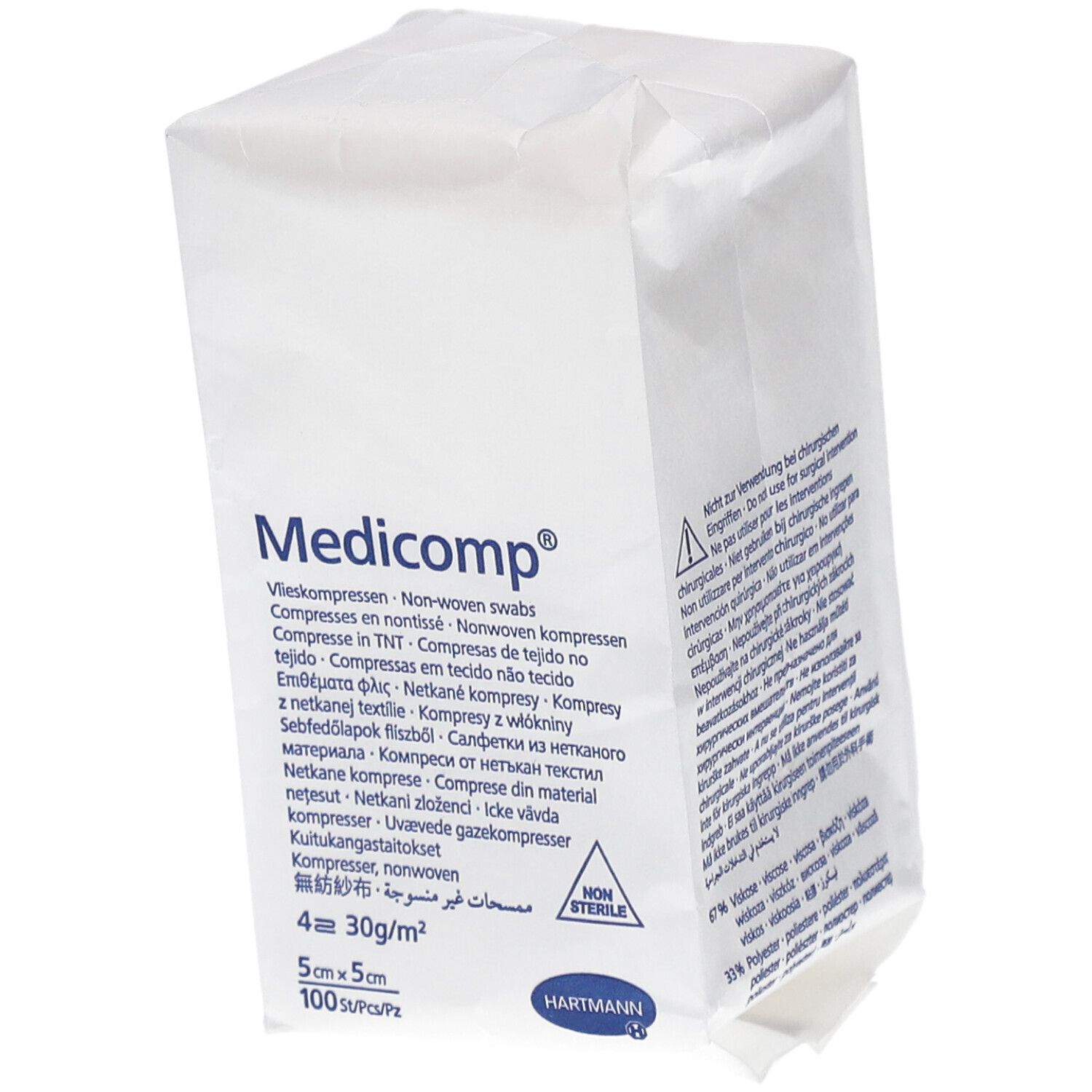 Emballage de compresses Medicomp®. Dimensions 5x5 cm, 100 pièces. Compresses non stériles. Logo Hartmann. Inscriptions multilingues.