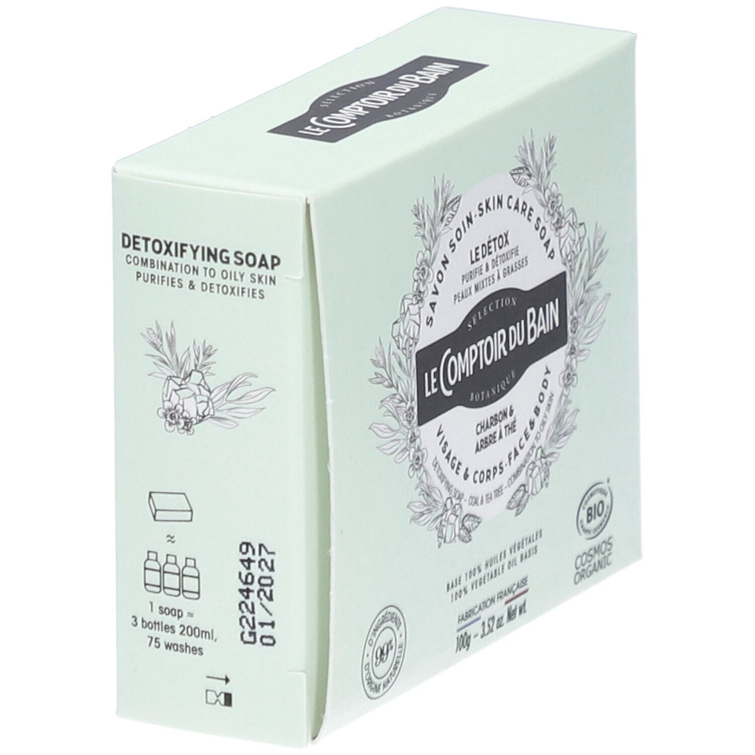Boîte vert clair, vue latérale. Inscriptions: Le Comptoir du Bain, Le Détox, Charbon & Arbre à thé. Informations produit et date de péremption.