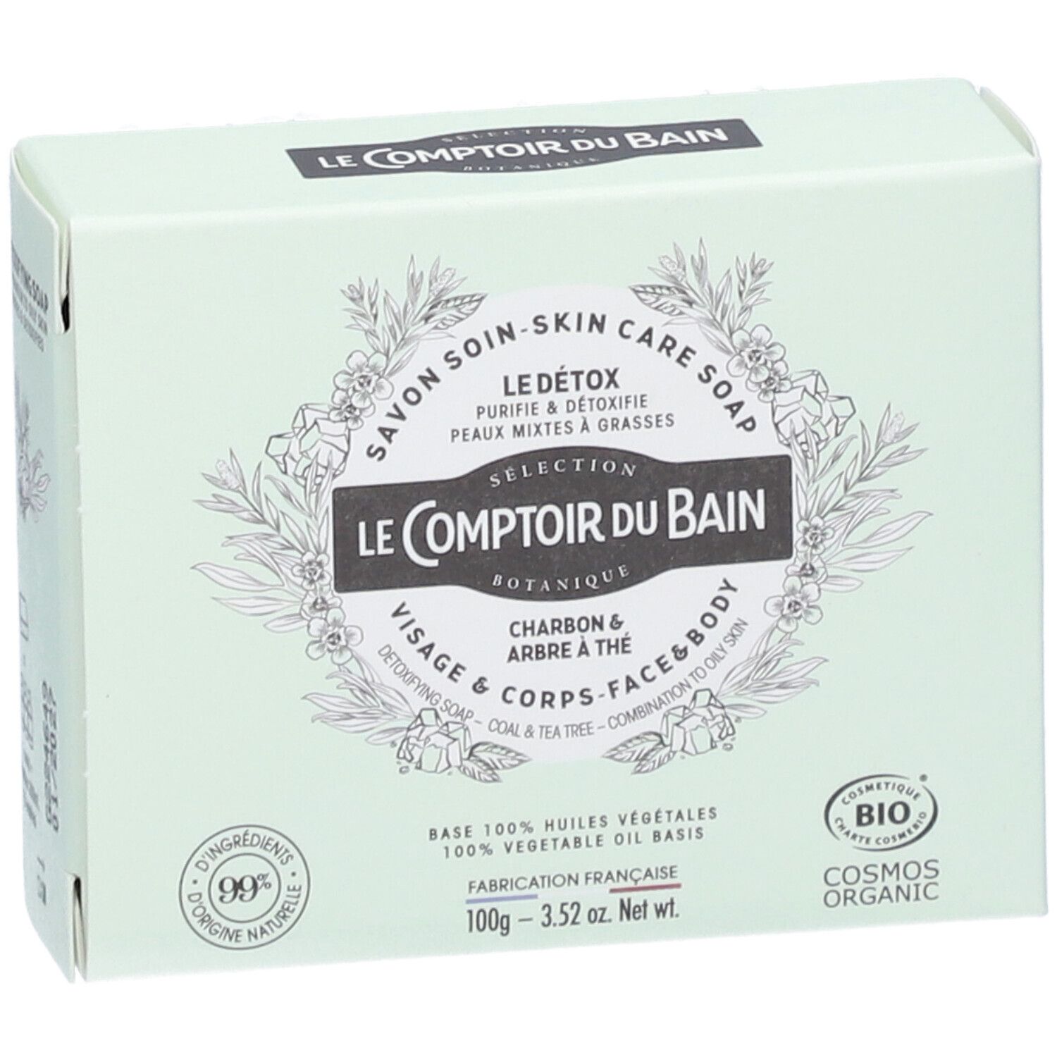 Boîte vert clair avec informations produit. Inscriptions: Le Comptoir du Bain, Le Détox, Charbon & Arbre à thé. Certification Cosmos Organic.