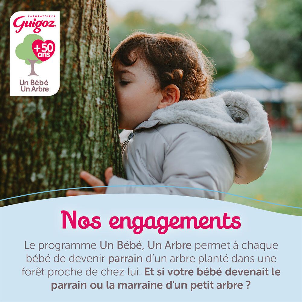 Logo Guigoz avec symbole d'arbre et texte 'Un Bébé, Un Arbre'. Enfant serrant un arbre.