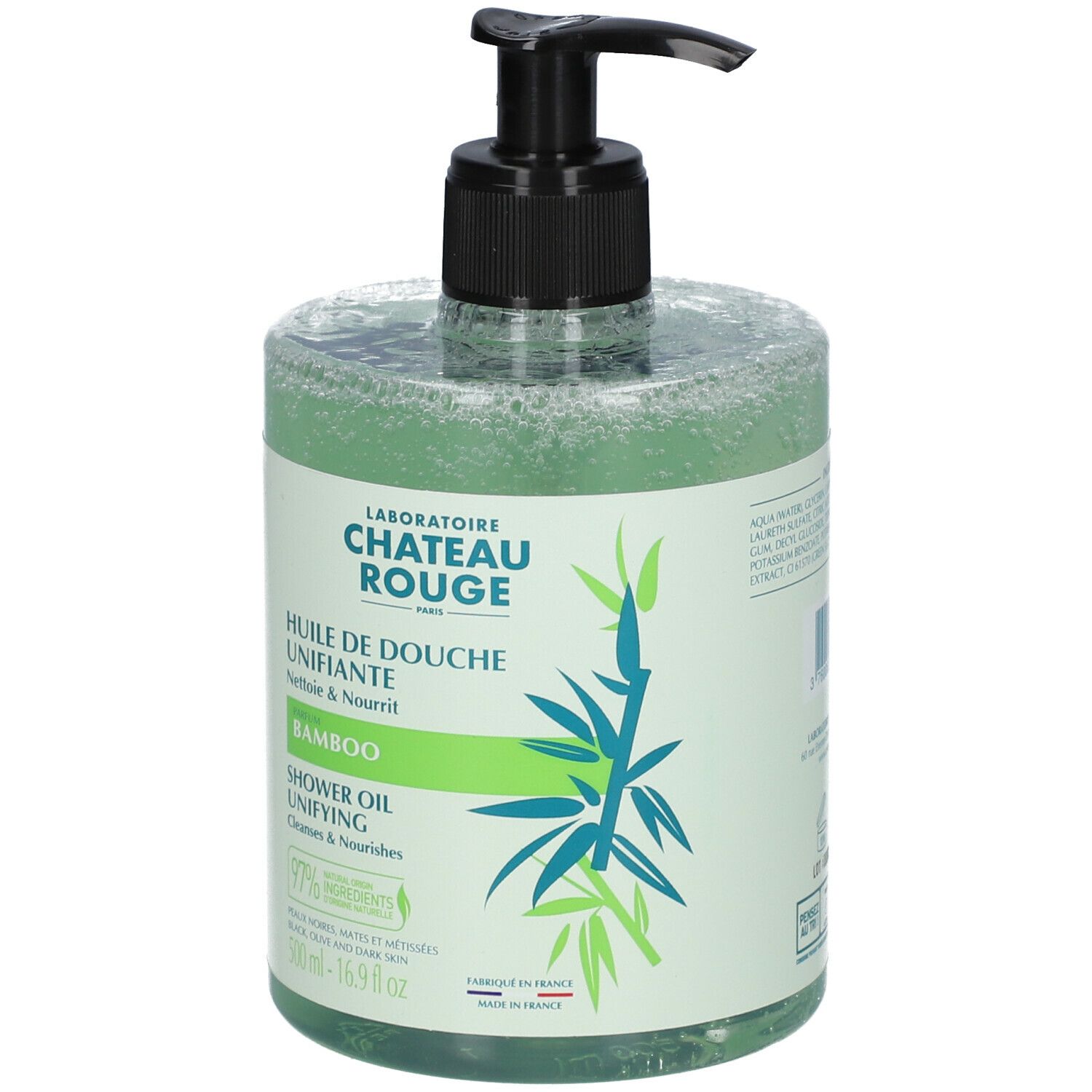 Flacon transparent d'huile de douche verte. Bouchon pompe noir. Inscription: Laboratoire Château Rouge, Bamboo, Shower Oil.
