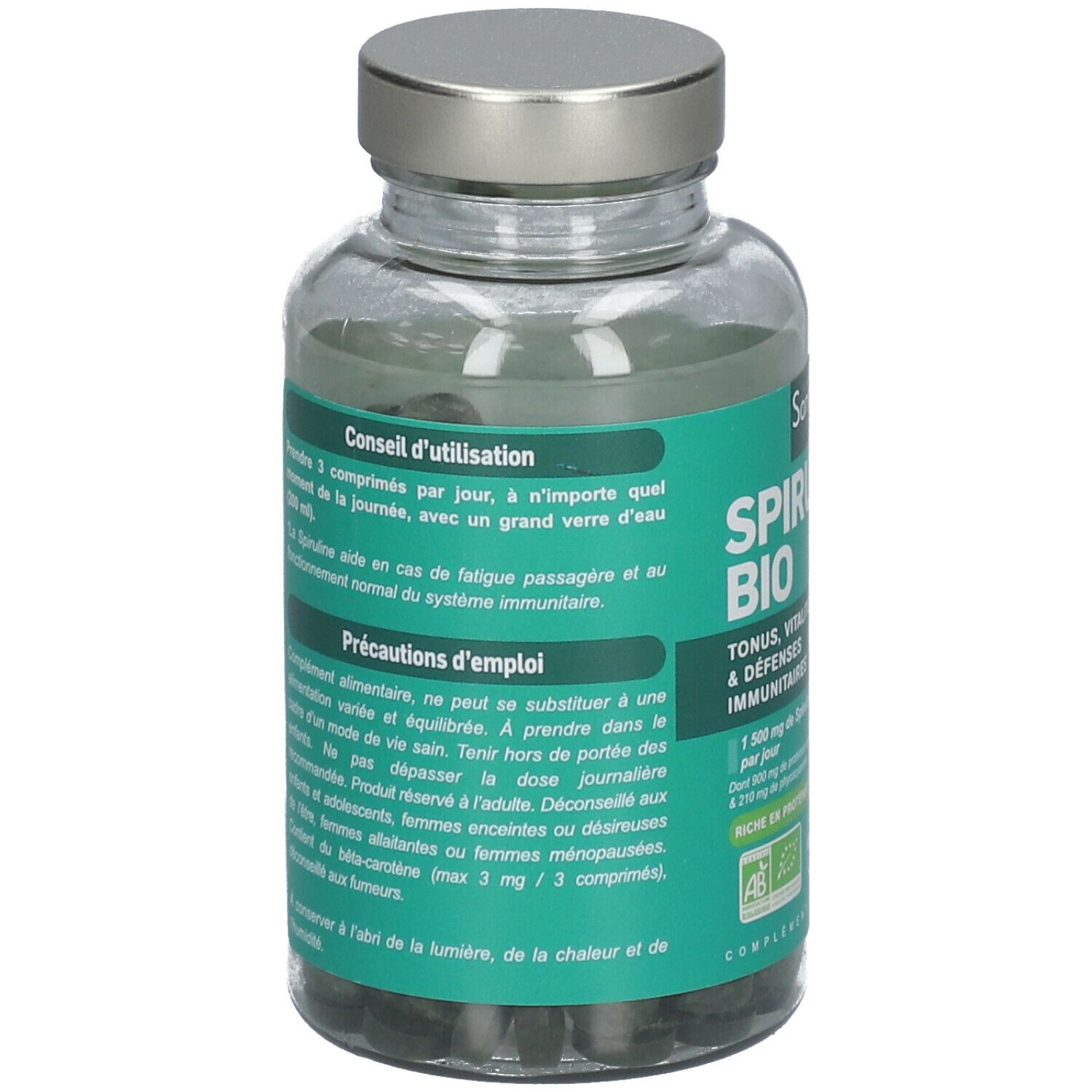 Flacon en verre avec comprimés verts. Inscription Spiruline Bio. Bouchon argenté. Texte en français.