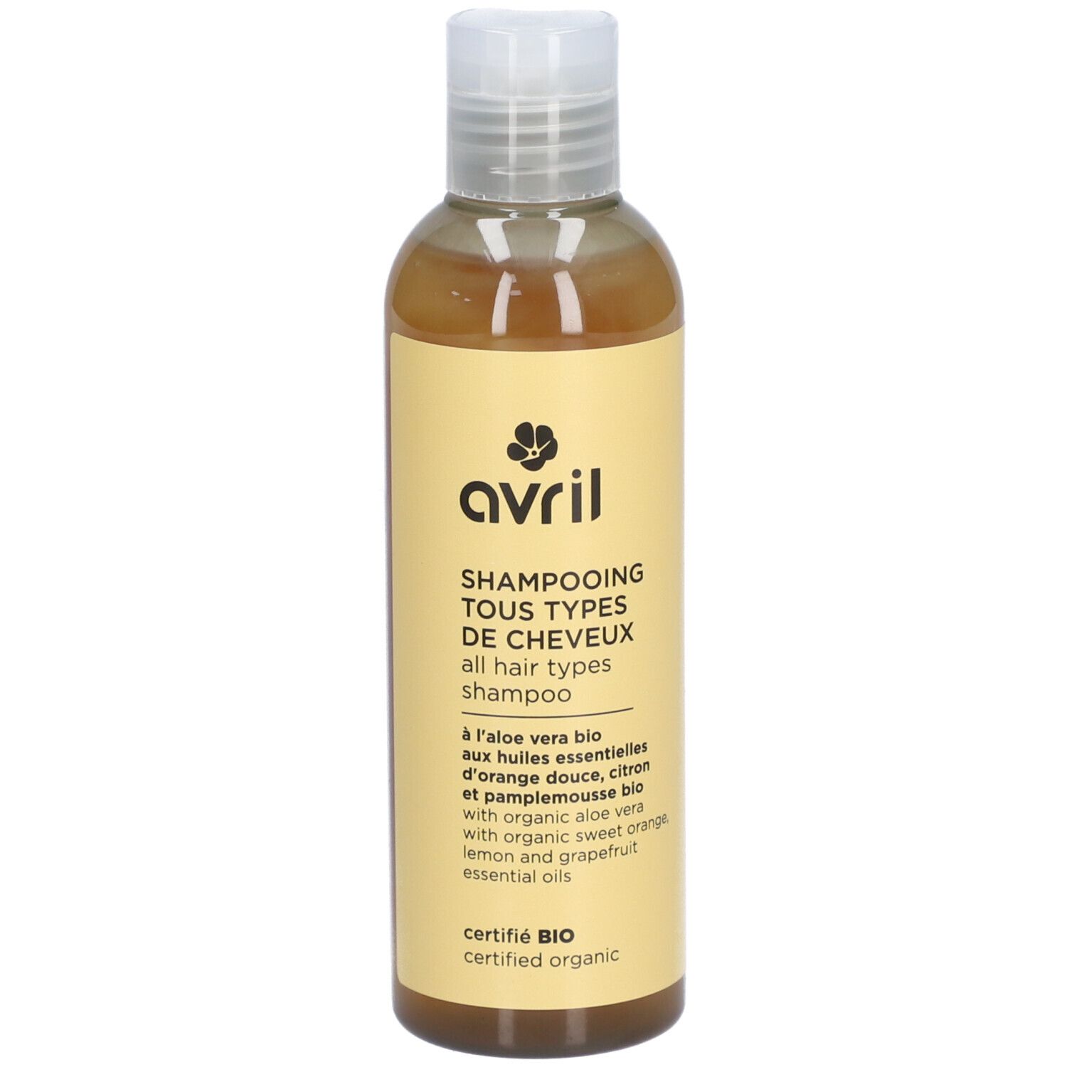 Flacon de Shampooing Tous Types de Cheveux. Étiquette jaune avec logo et informations. Certifié BIO, contient aloe vera.
