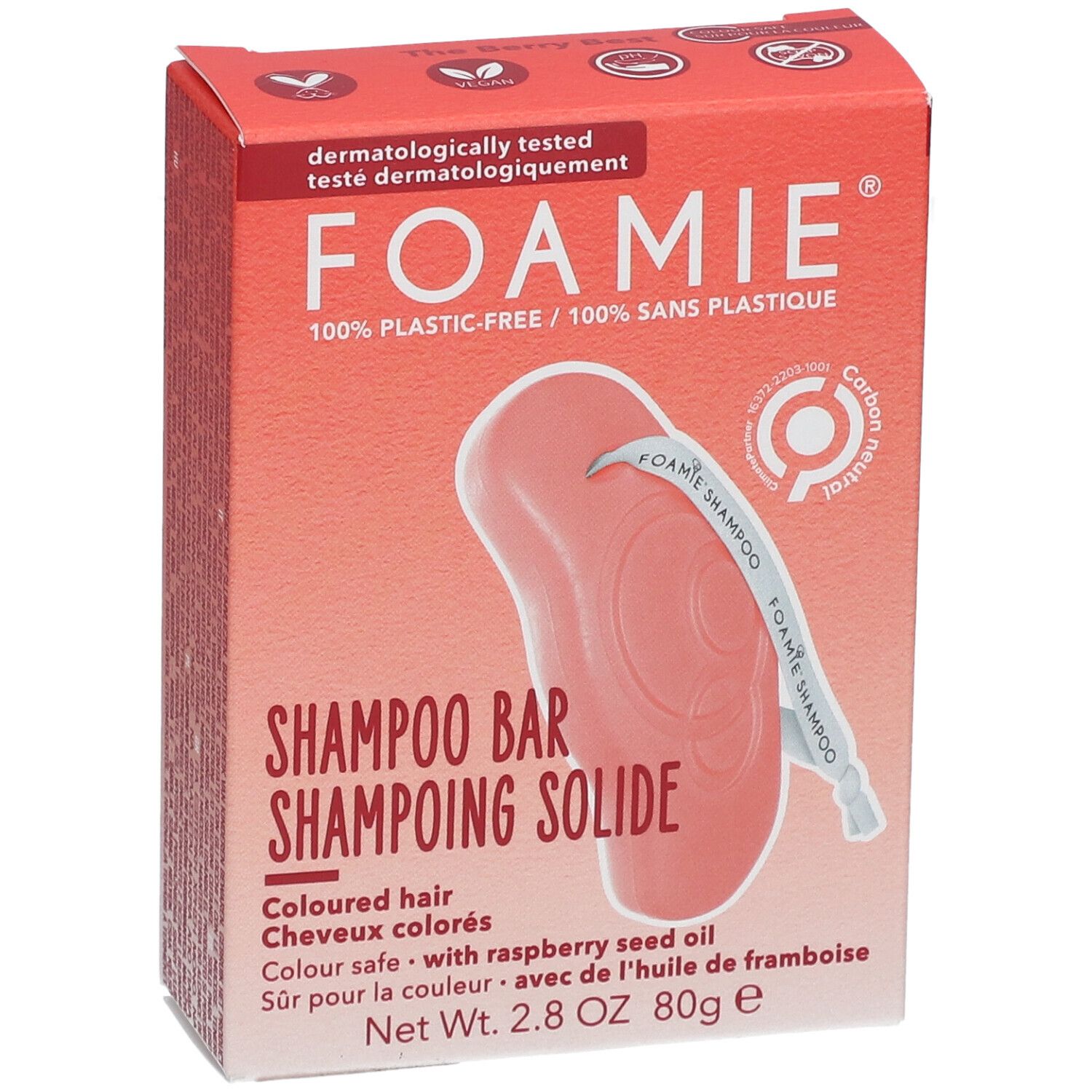 Boîte rouge avec Shampooing Solide. Inscription : FOAMIE, Shampooing Solide, pour cheveux colorés. Contient de l'huile de framboise. Gros plan.