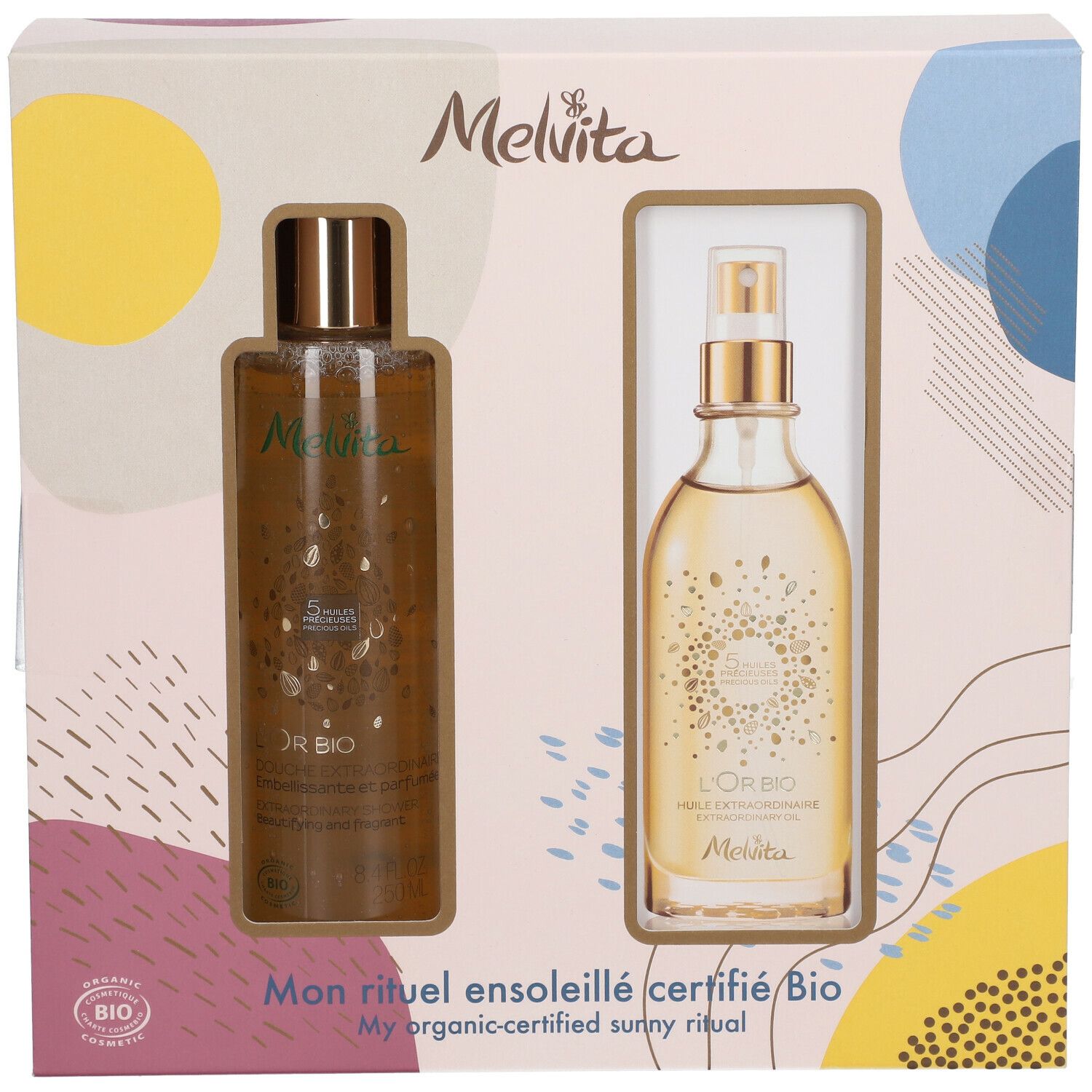 Coffret avec deux produits Melvita. Flacon avec vaporisateur et flacon avec bouchon à vis. Inscription : L'Or BIO, Mon rituel ensoleillé certifié Bio. Certification Bio.