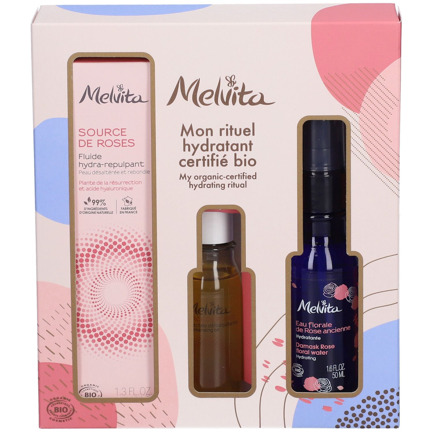 Coffret cadeau avec trois produits. À gauche : flacon de fluide. Au centre : petite bouteille. À droite : flacon bleu avec vaporisateur.