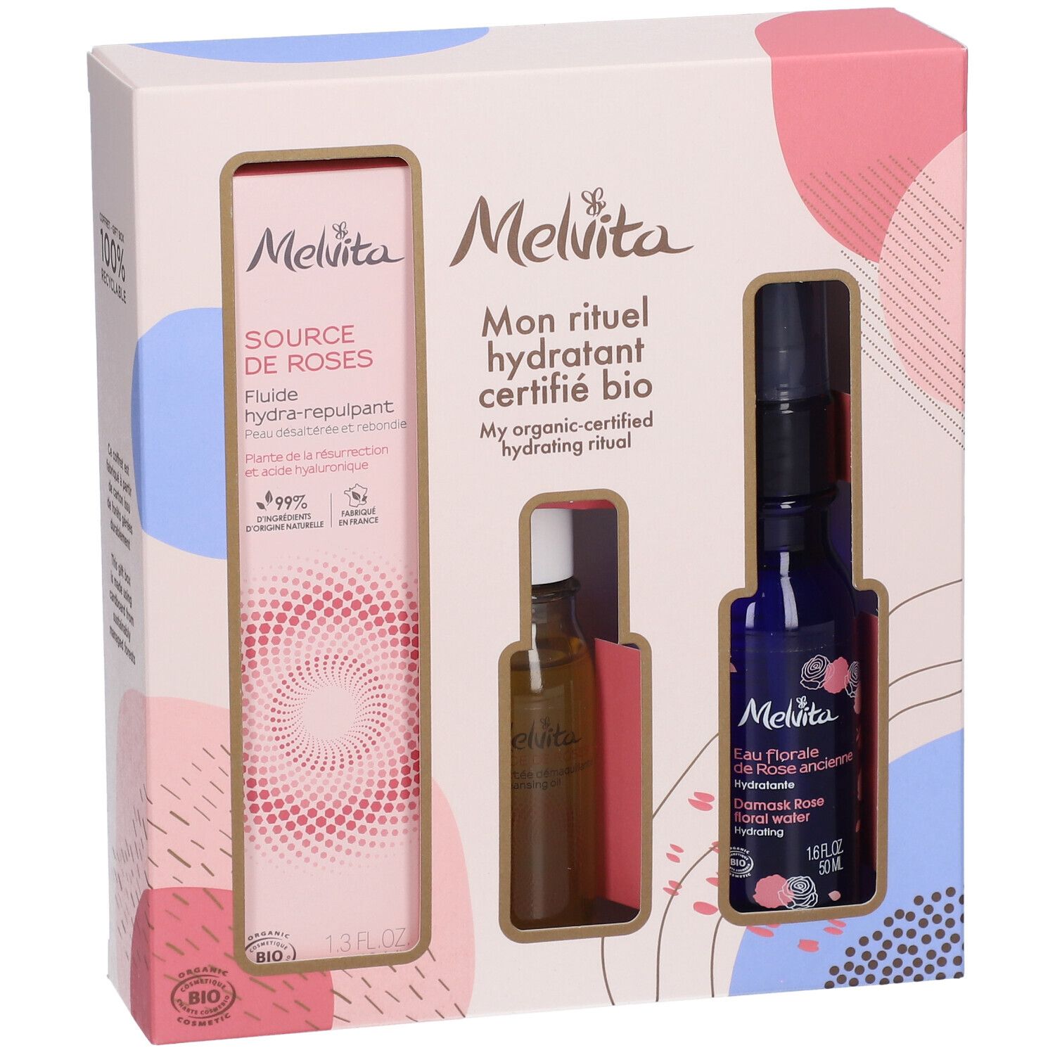 Coffret cadeau avec trois produits. À gauche : flacon de fluide. Au centre : petite bouteille. À droite : flacon bleu avec vaporisateur.
