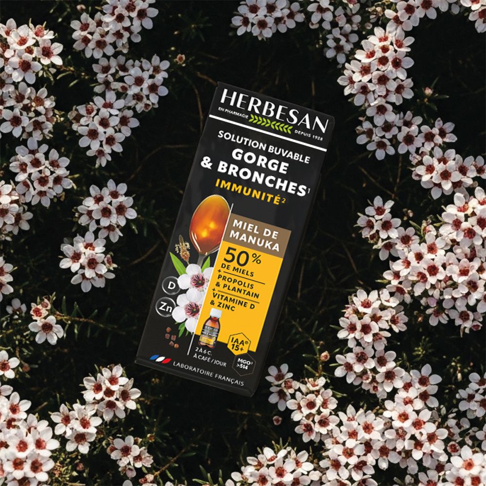 Herbesan Sirop Miel de Manuka IAA15+ – Flacon sur fleurs. GORGES & BRONCHES IMMUNITÉ.