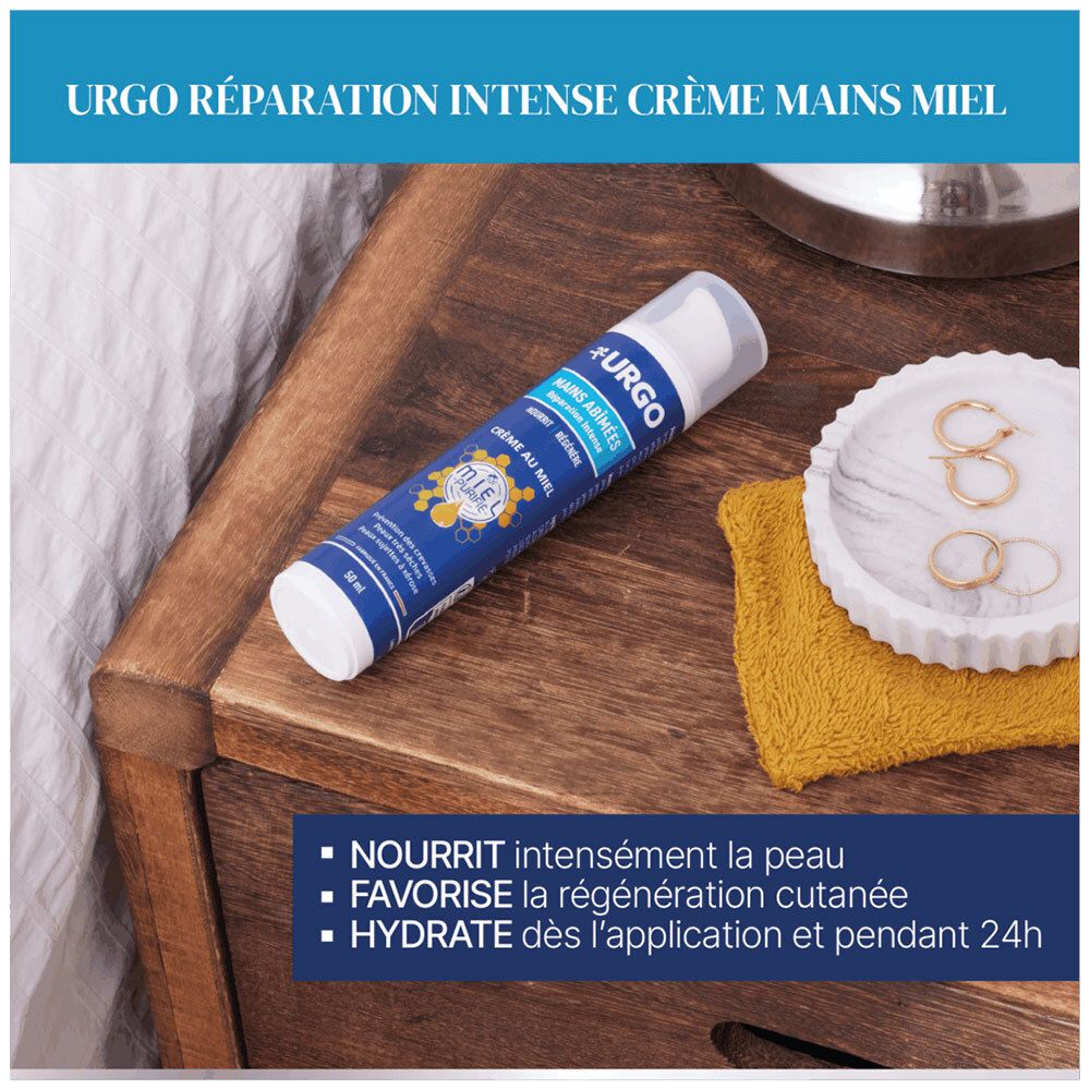 URGO Crème mains miel sur table de nuit, flacon pompe 50ml.