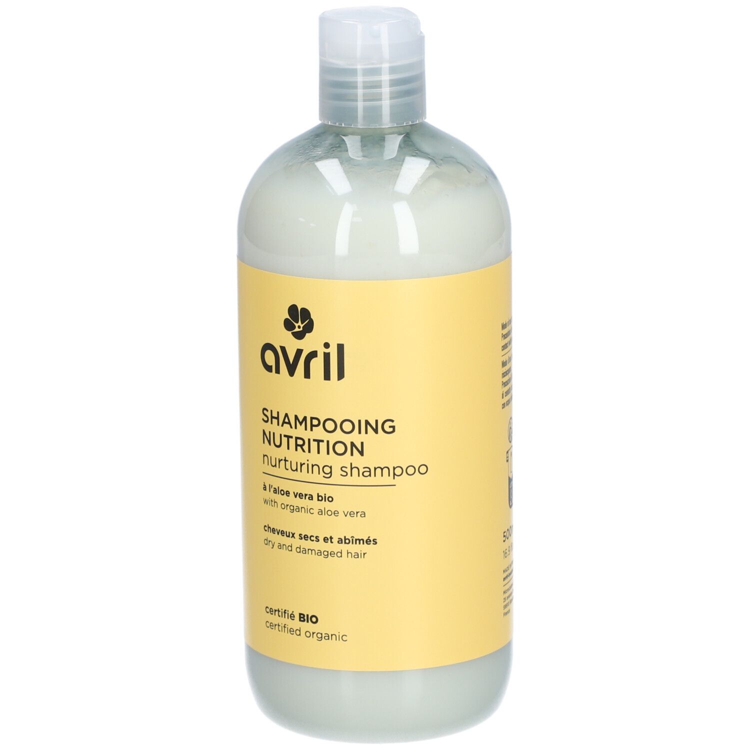 Flacon de Shampooing Nutrition. Étiquette jaune avec logo et texte. Produit bio certifié. Pour cheveux secs et abîmés.