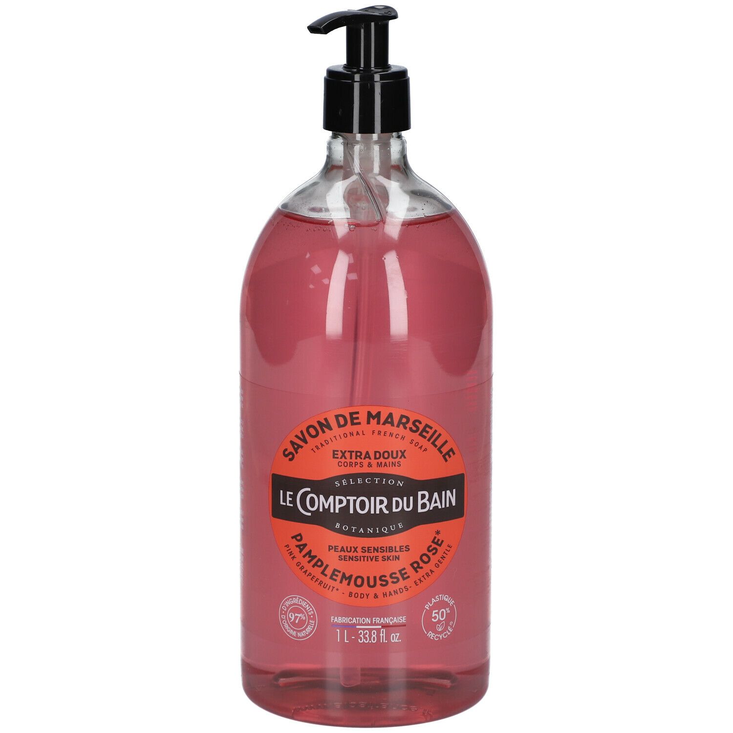 Flacon transparent de savon liquide rose avec pompe noire. Étiquette avec informations produit.