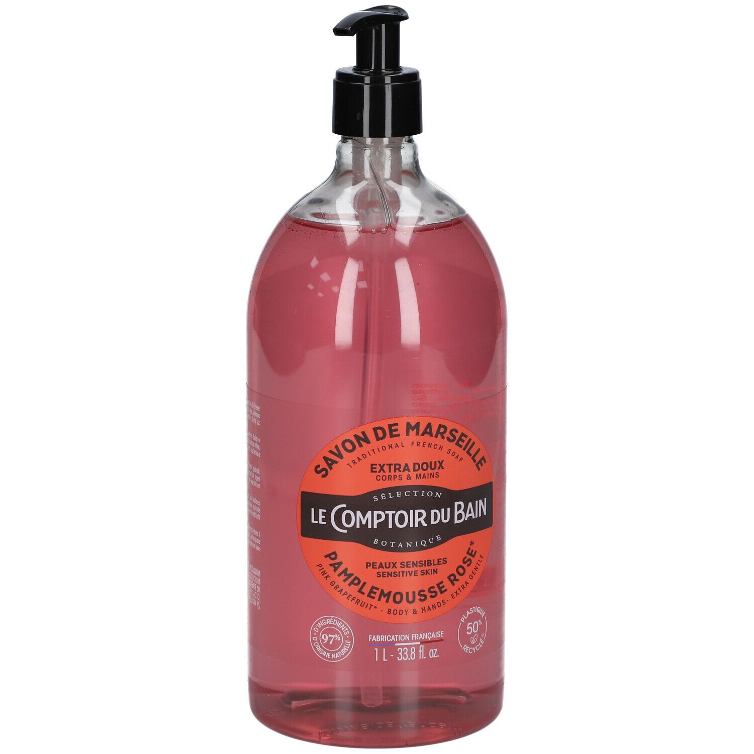 Flacon transparent de savon liquide rose avec pompe noire. Étiquette avec informations produit.