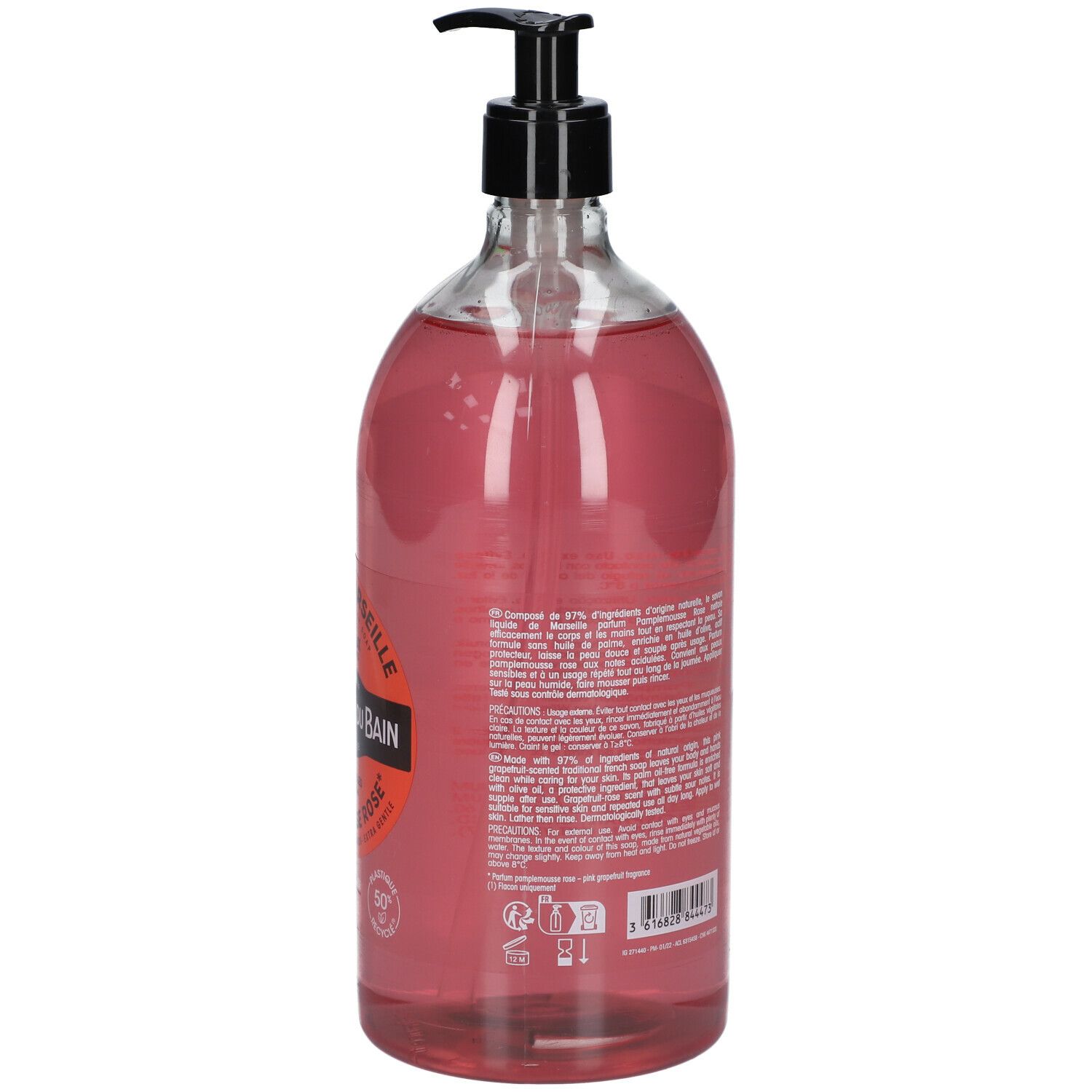 Dos du flacon transparent de savon liquide rose. Texte sur l'étiquette, pompe noire.
