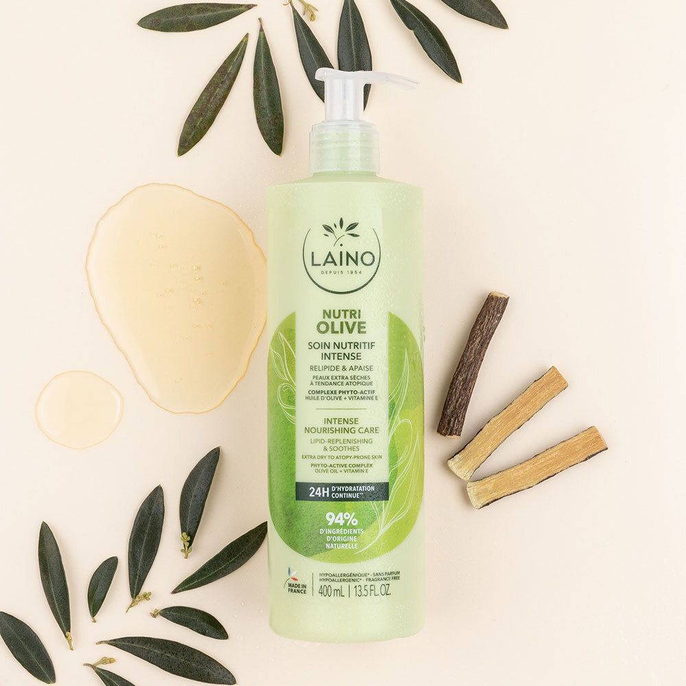 Flacon vert avec pompe, branches d'olivier et morceaux de bois. Inscription: LAINO, Nutri Olive, Soin nutritif intense.