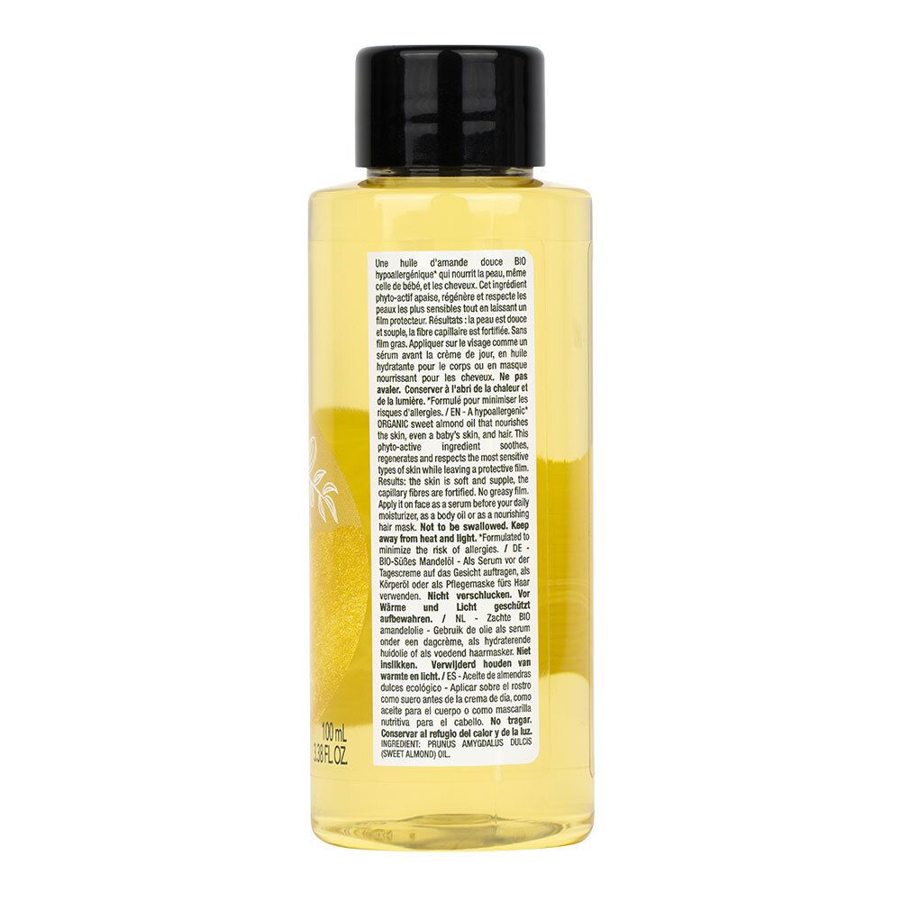 Dos de la bouteille LAINO Huile d’amande douce bio. Texte multilingue, huile jaune visible.
