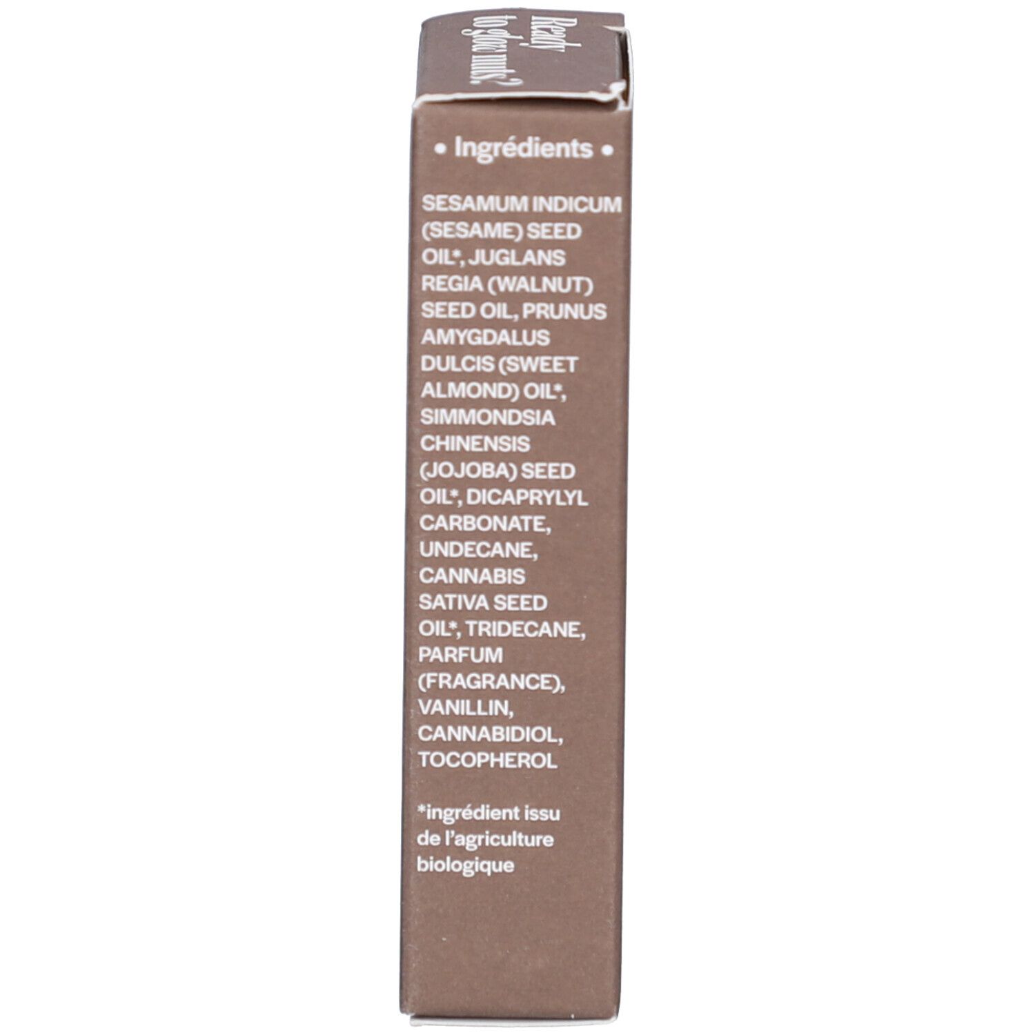 Emballage marron. Inscription : Ingrédients. Liste d'huiles et d'ingrédients. Texte en français.