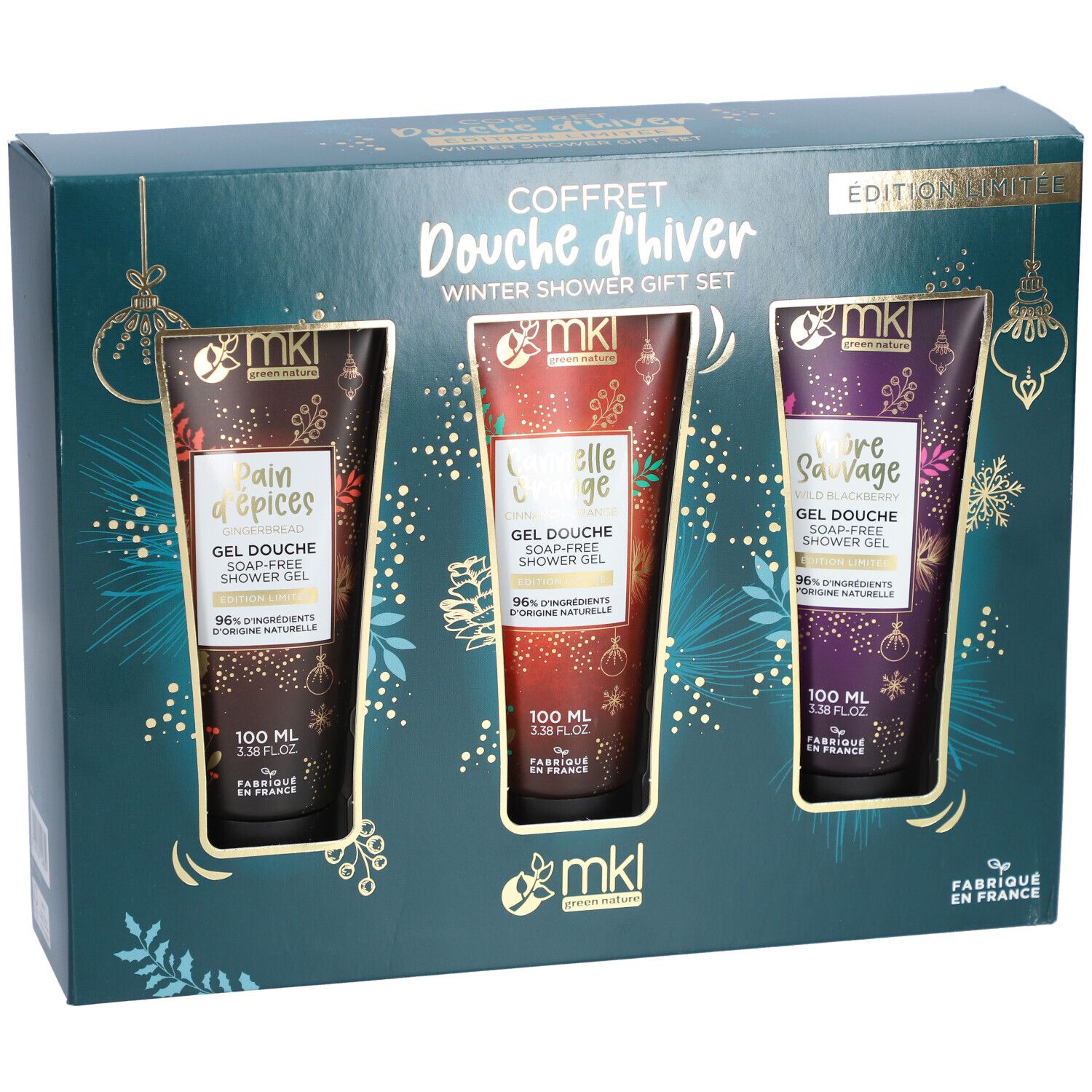 Coffret cadeau avec trois gels douche dans une boîte. Chaque gel a une couleur et une inscription différentes. L'emballage est bleu foncé avec des accents dorés.