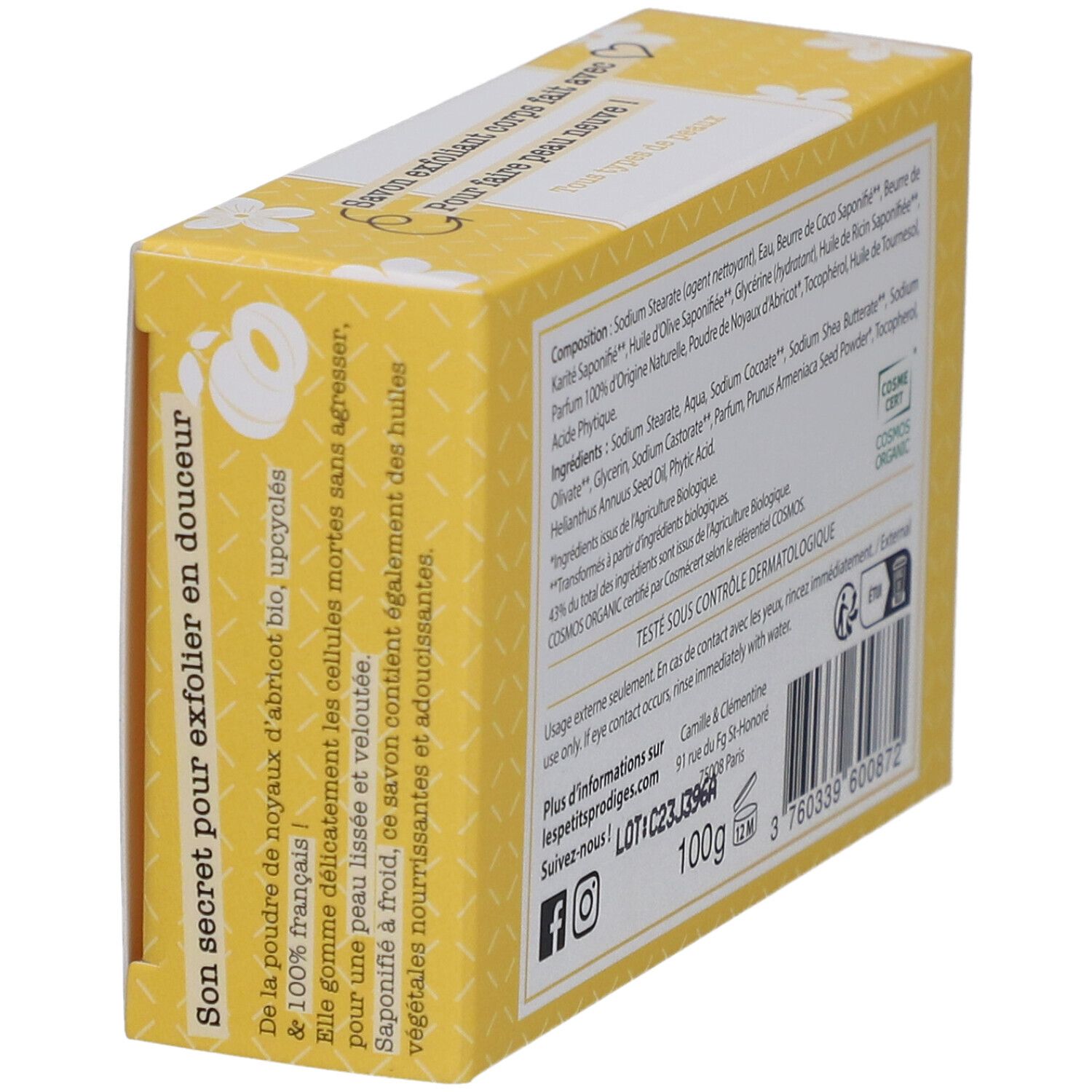 Boîte jaune à motifs floraux blancs. Inscription: SAVON EXFOLIANT, 100% d'origine naturelle. Texte sur l'huile de noyau d'abricot.