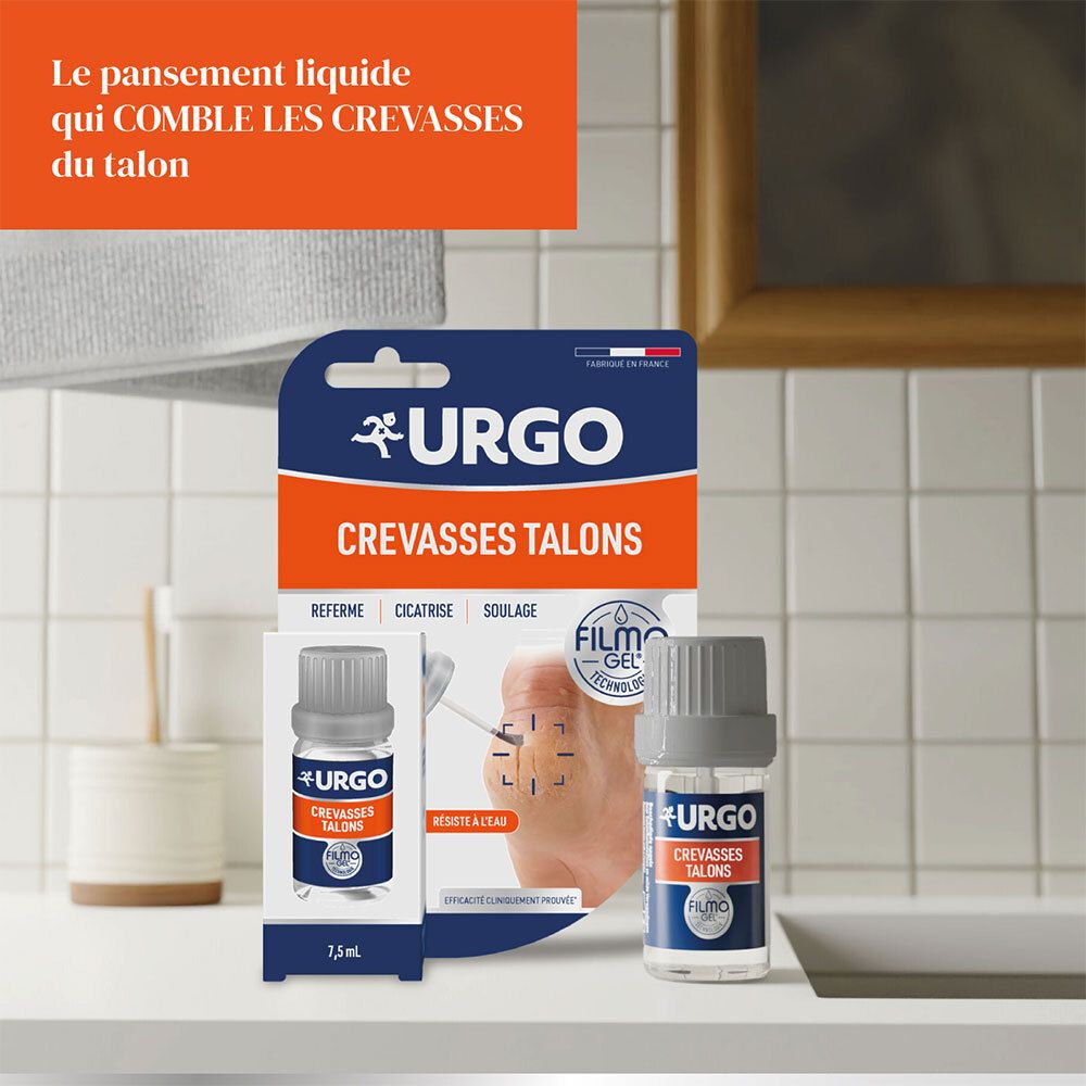 Emballage produit et flacon. Inscription: URGO, Crevasses Talons, Filmogel. Flacon près d'un lavabo.