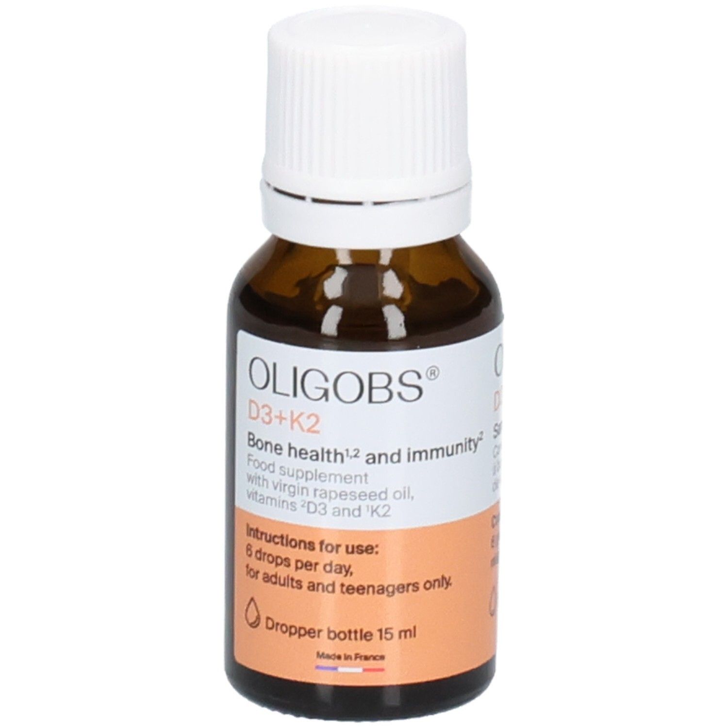 Flacon en verre ambré avec bouchon compte-gouttes blanc. OLIGOBS D3+K2, complément alimentaire aux vitamines.