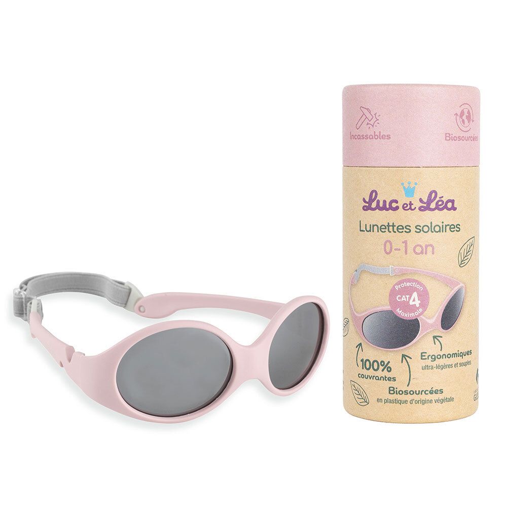 Lunettes de soleil bébé roses et emballage. Inscription : Luc & Léa, 0-1 an, CAT 4. Lunettes avec bandeau.