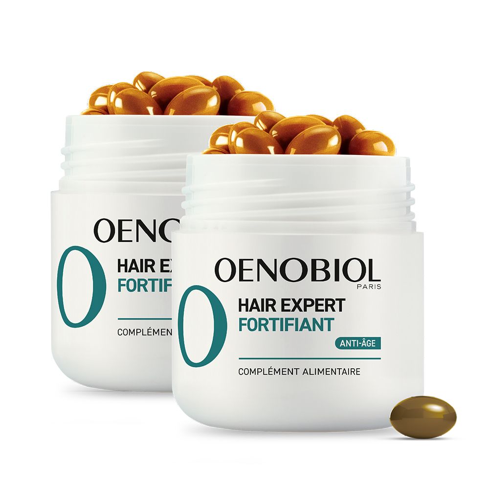 Deux pots blancs avec gélules. OENOBIOL Hair Expert Fortifiant. Gélules brunes. Texte anti-âge.