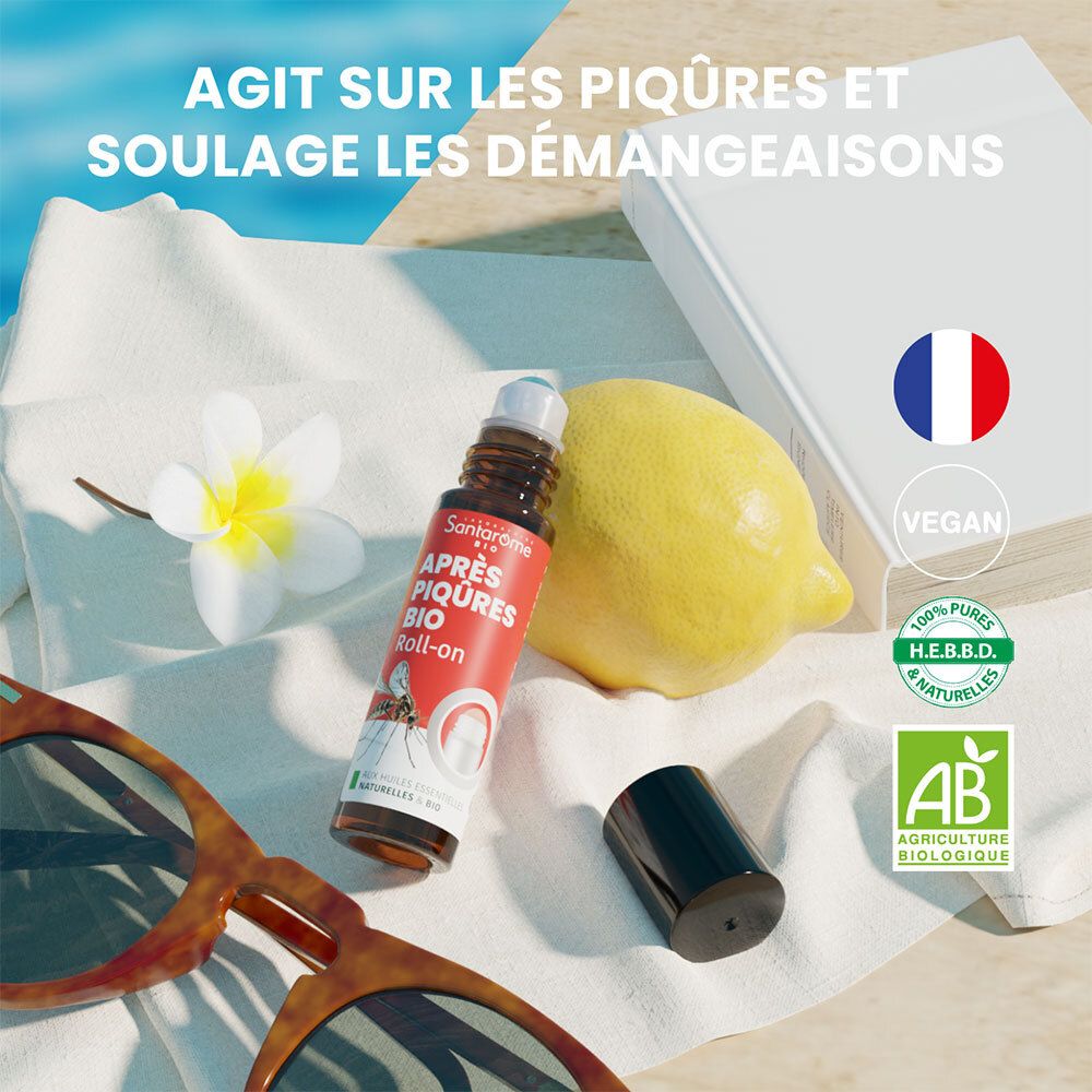 Santarome Après-Piqûres Bio Roll-on près d'un citron, lunettes de soleil et livre. Label Vegan, logo AB.
