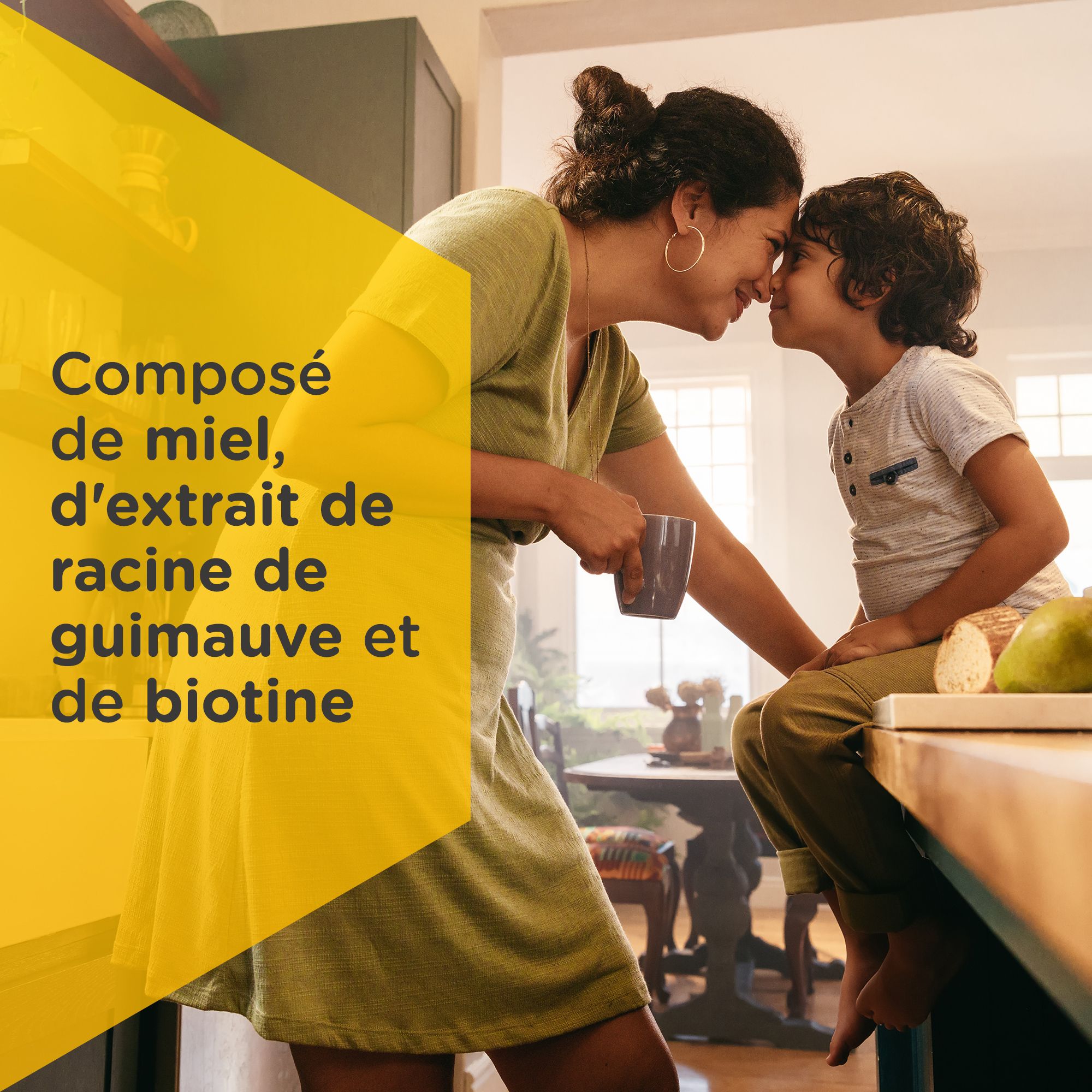 Mère et enfant se touchent. Texte: Composé de miel, d'extrait de racine de guimauve et de biotine.