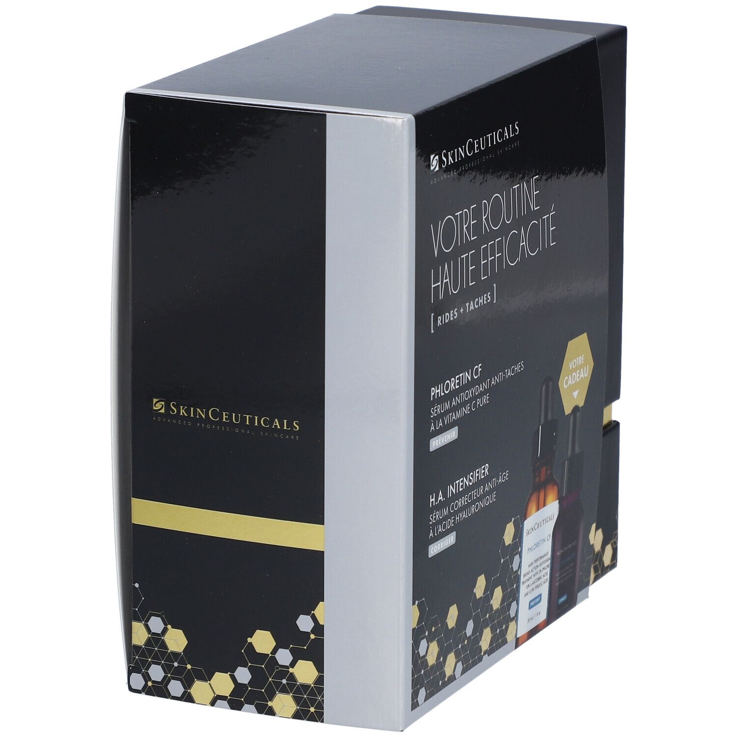 Coffret noir partiellement ouvert. Logo et nom du produit visibles. Accents dorés. Contient deux flacons.