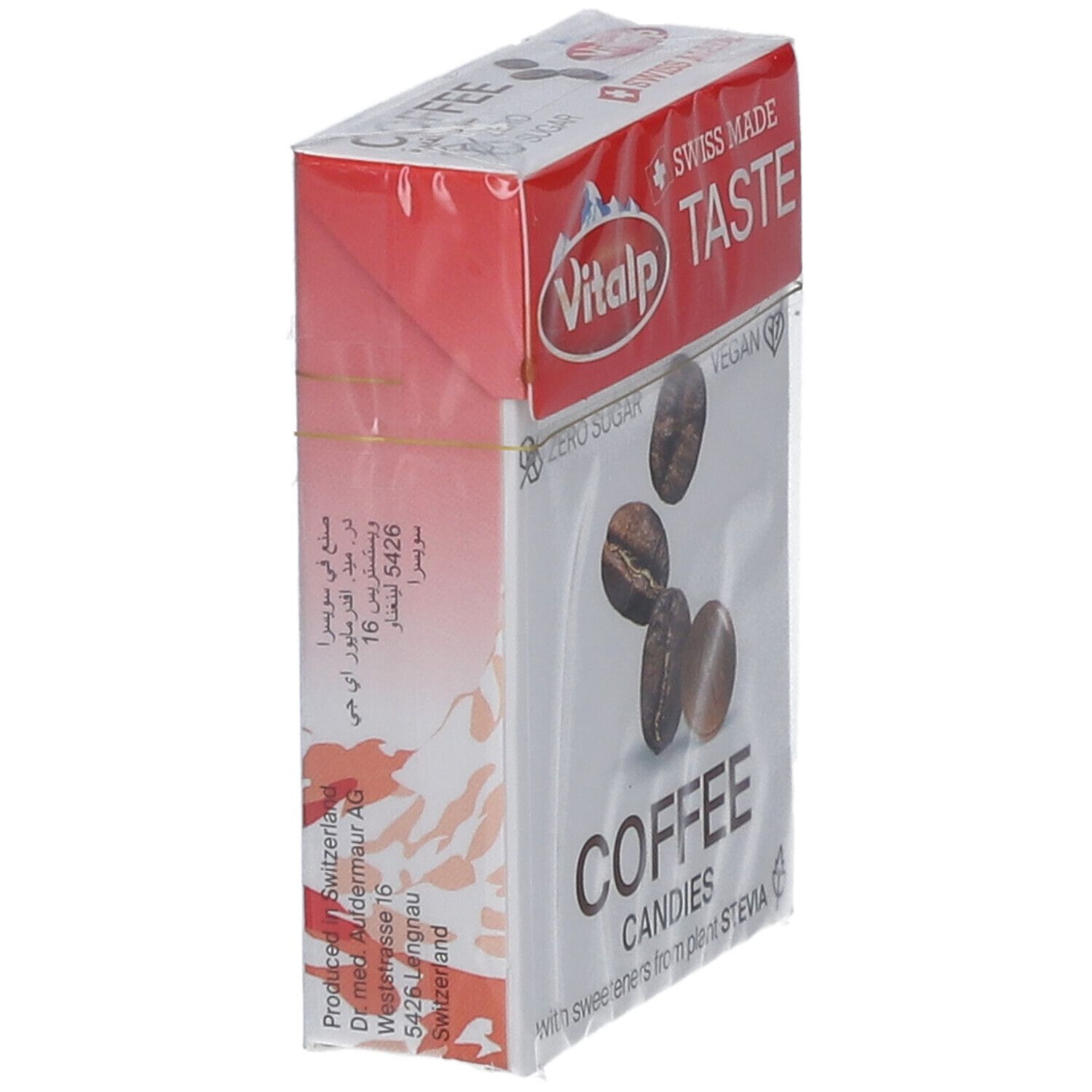 Vue en biais de l'emballage des bonbons au café Vitalp. Boîte rouge et blanche avec image de café. Texte : "Coffee Candies".