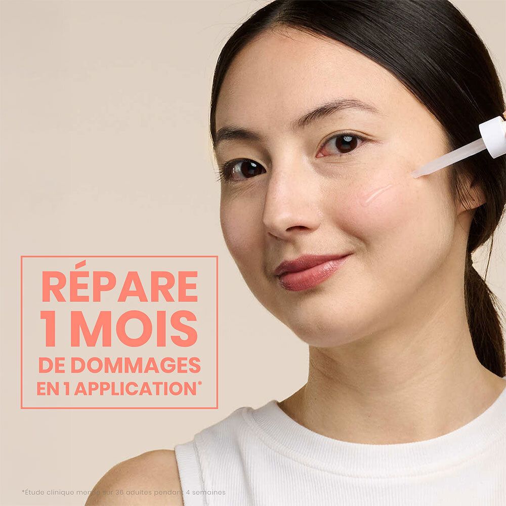 Femme avec applicateur de sérum. Texte : Répare 1 mois de dommages en 1 application.