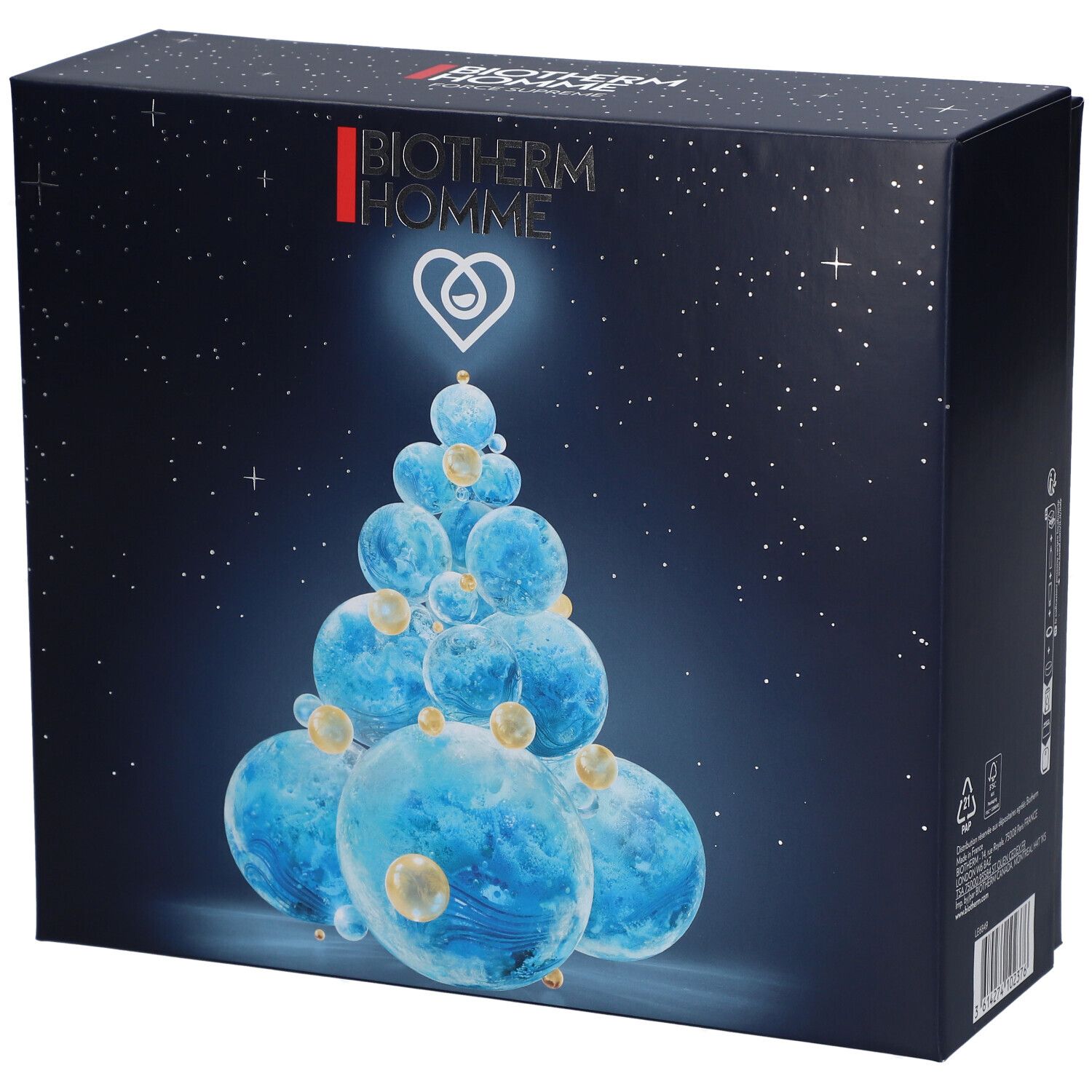 Coffret cadeau bleu foncé BIOTHERM HOMME. Représentation d'un sapin de Noël fait de boules bleues. Étoiles en arrière-plan.