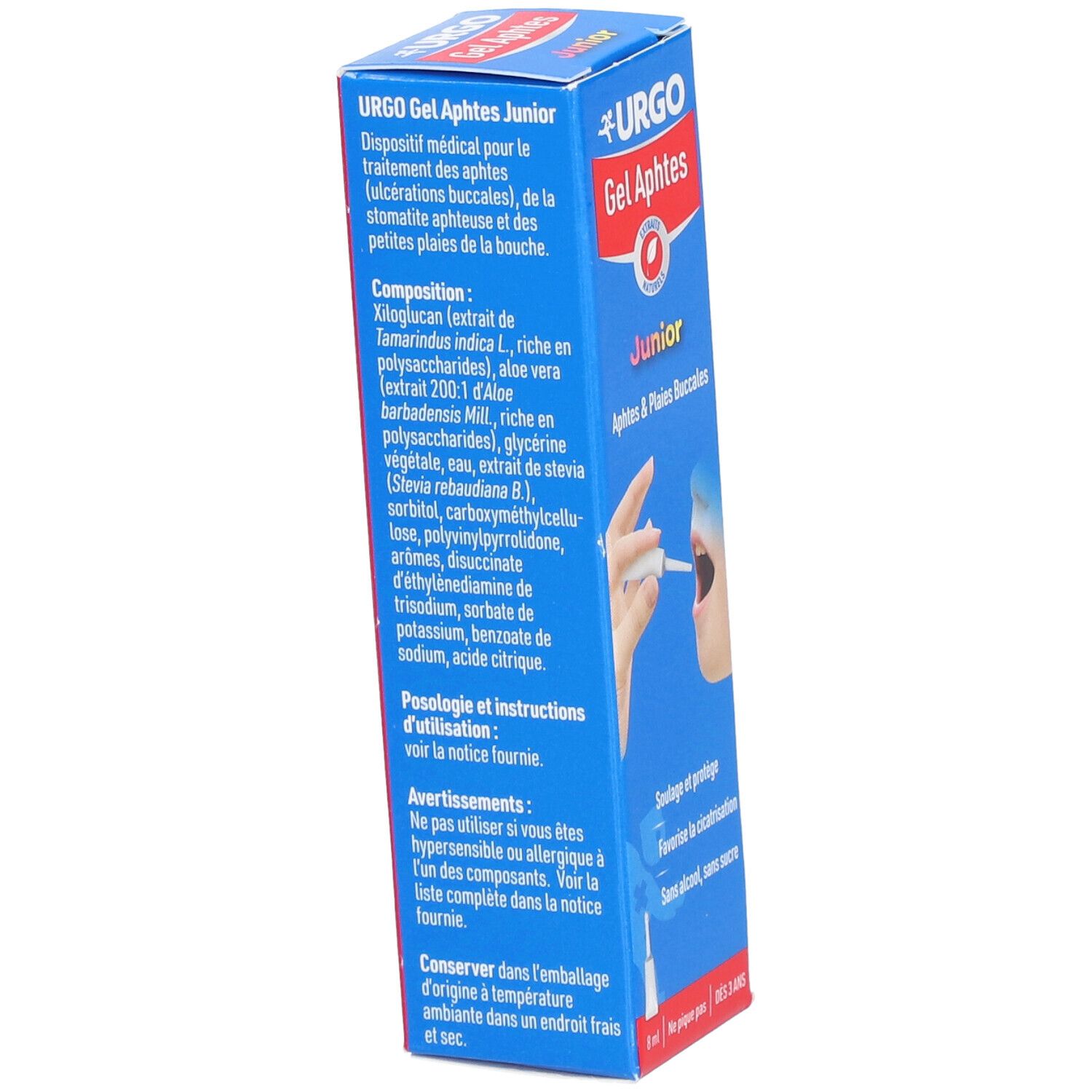 Boîte bleue avec informations produit. Texte: URGO Gel Aphtes Junior. Ingrédients, instructions d'utilisation et avertissements.