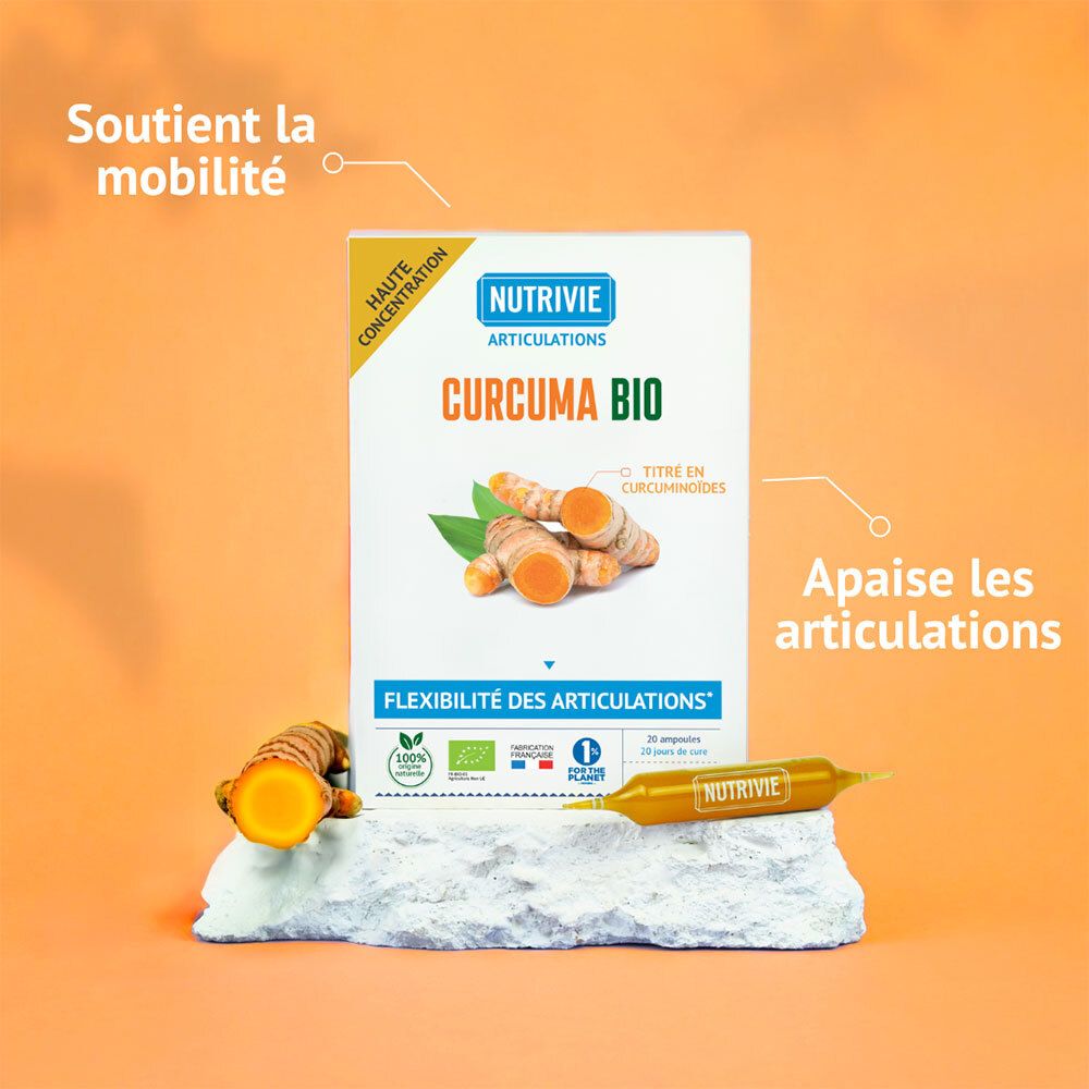 Boîte et ampoule Nutrivie Curcuma Bio sur pierre. Racines de curcuma à côté.