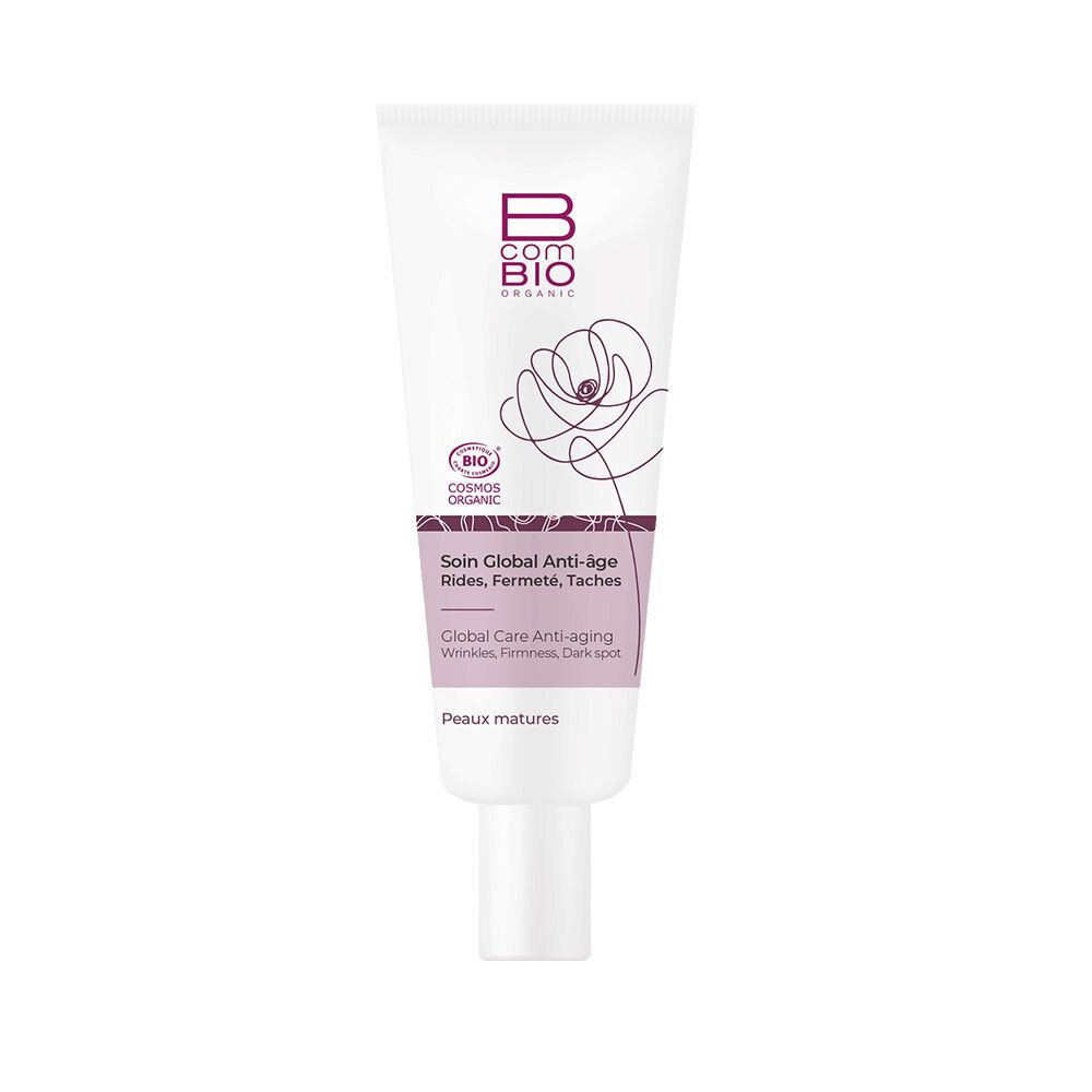 Tube blanc avec logo B COM BIO, motif floral violet et nom du produit. Produit cosmétique pour peaux matures.
