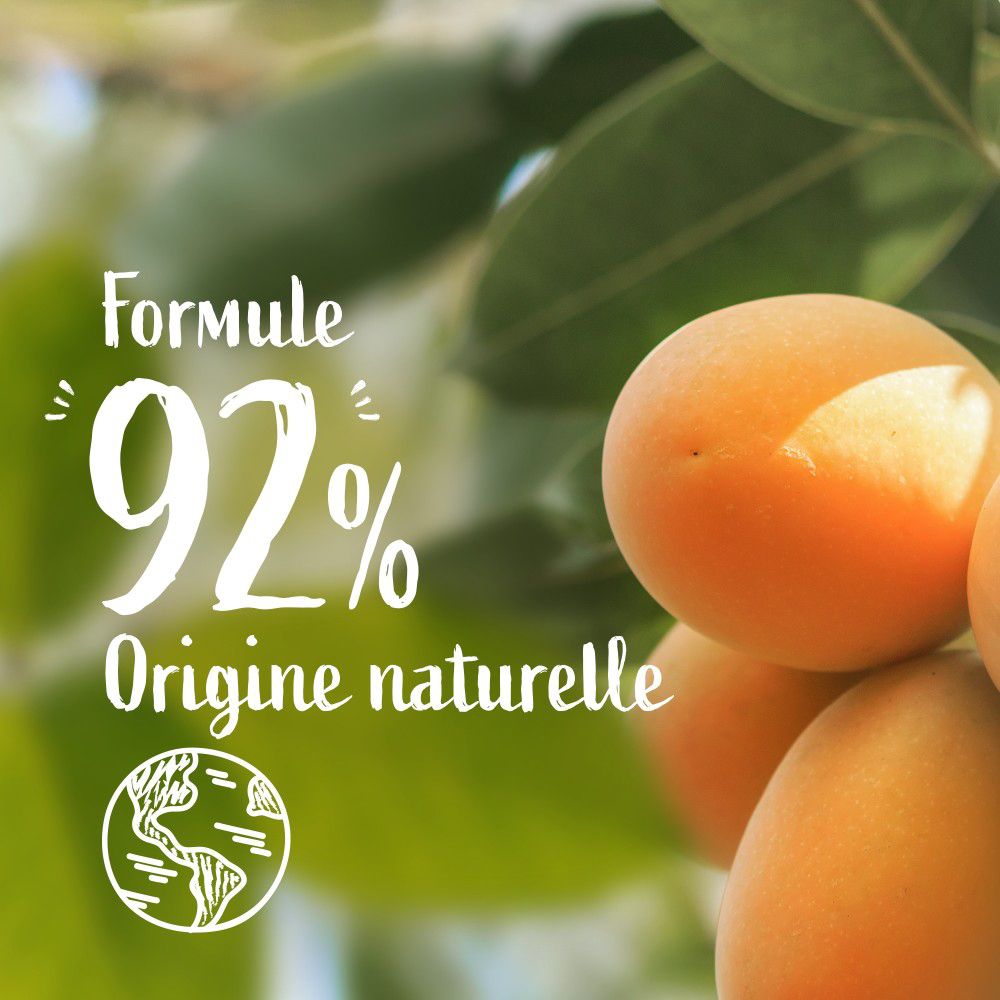 Texte: 92% d'ingrédients naturels. Le Petit Marseillais Crème de Douche & Bain. Abricot BIO & Noisette BIO. Symbole du globe.