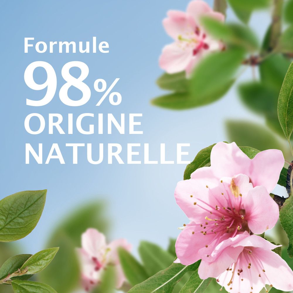 Fleurs et feuilles. Texte: Formule 98% d'origine naturelle.