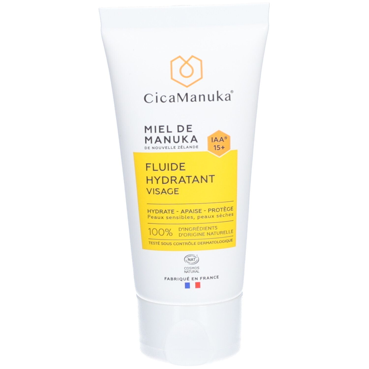 Tube blanc avec étiquette jaune. Inscription: CicaManuka, miel de Nouvelle-Zélande, IAA15+, fluide hydratant visage. 100% ingrédients d'origine naturelle.