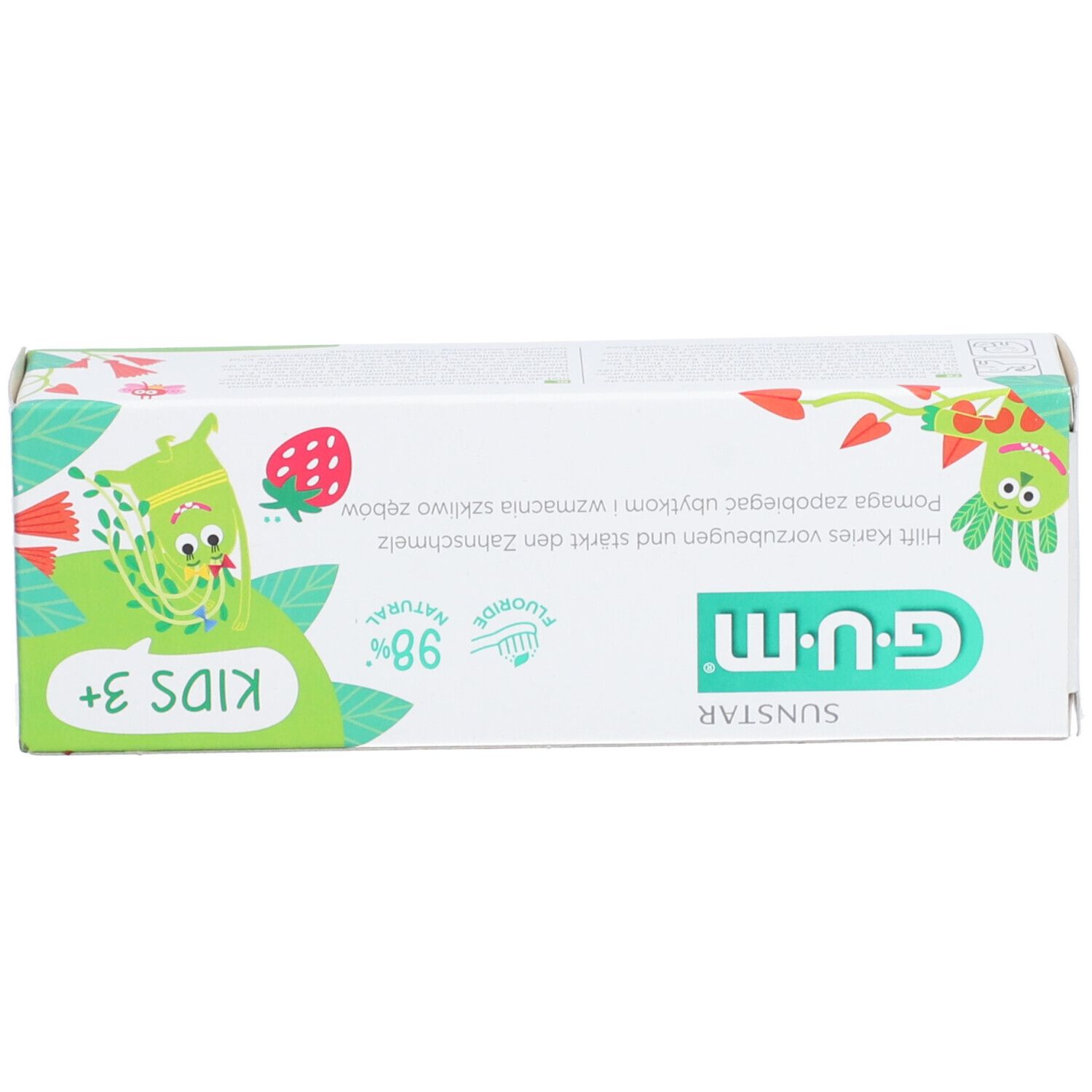 Boîte de dentifrice. Inscription 'KIDS 3+' et 'G.U.M'. Contient 98% d'ingrédients naturels et du fluorure. Avec illustrations de dessins animés.