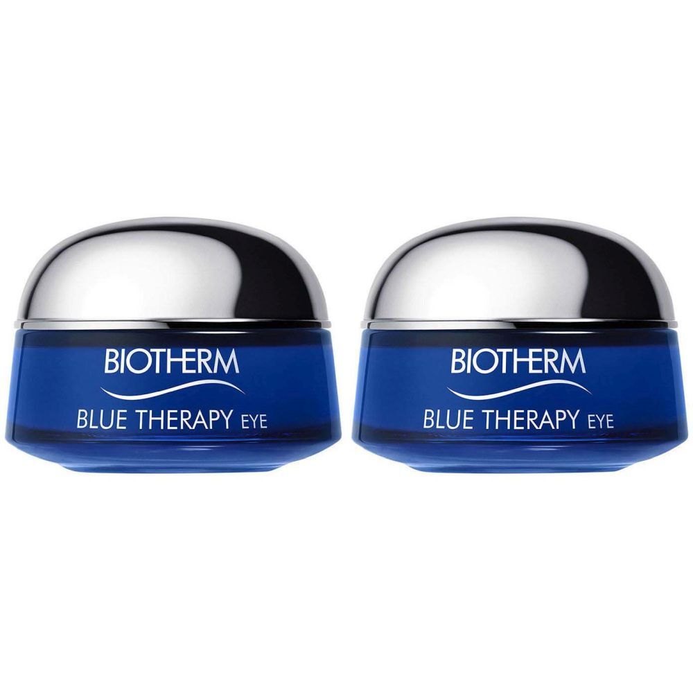 Deux pots bleus avec couvercles argentés. Sur le devant, "BIOTHERM BLUE THERAPY EYE" est écrit.