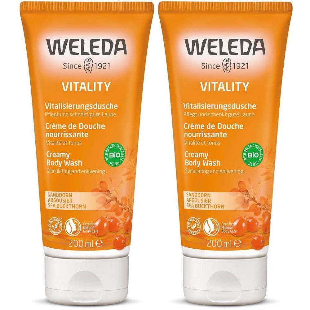 Deux tubes de WELEDA Vitality. Emballage orange avec bouchon blanc. Texte: Vitality, Crème de Douche, Sanddorn.