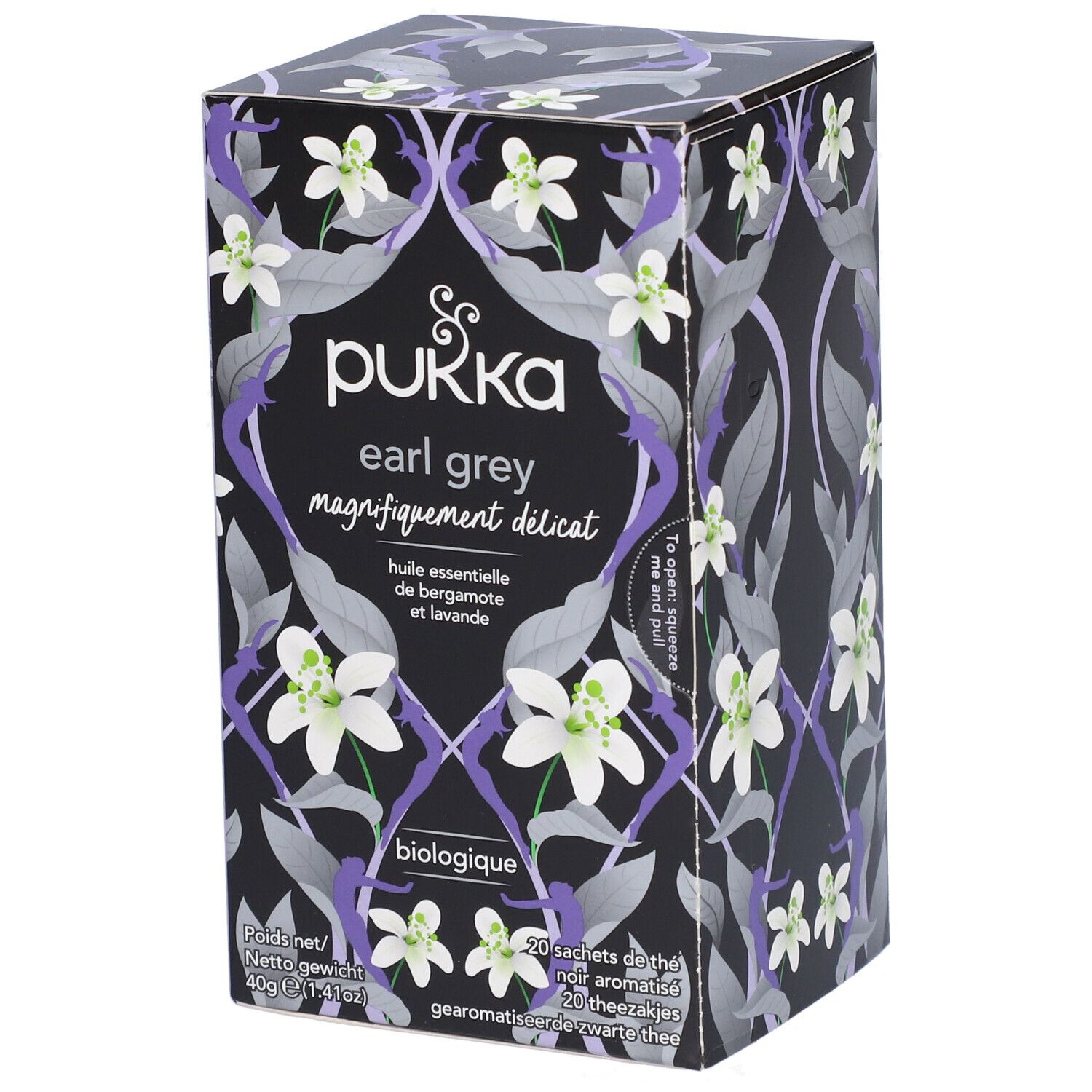 Boîte de thé Pukka Earl Grey. Fond noir avec motif floral et nom du produit. Biologique.