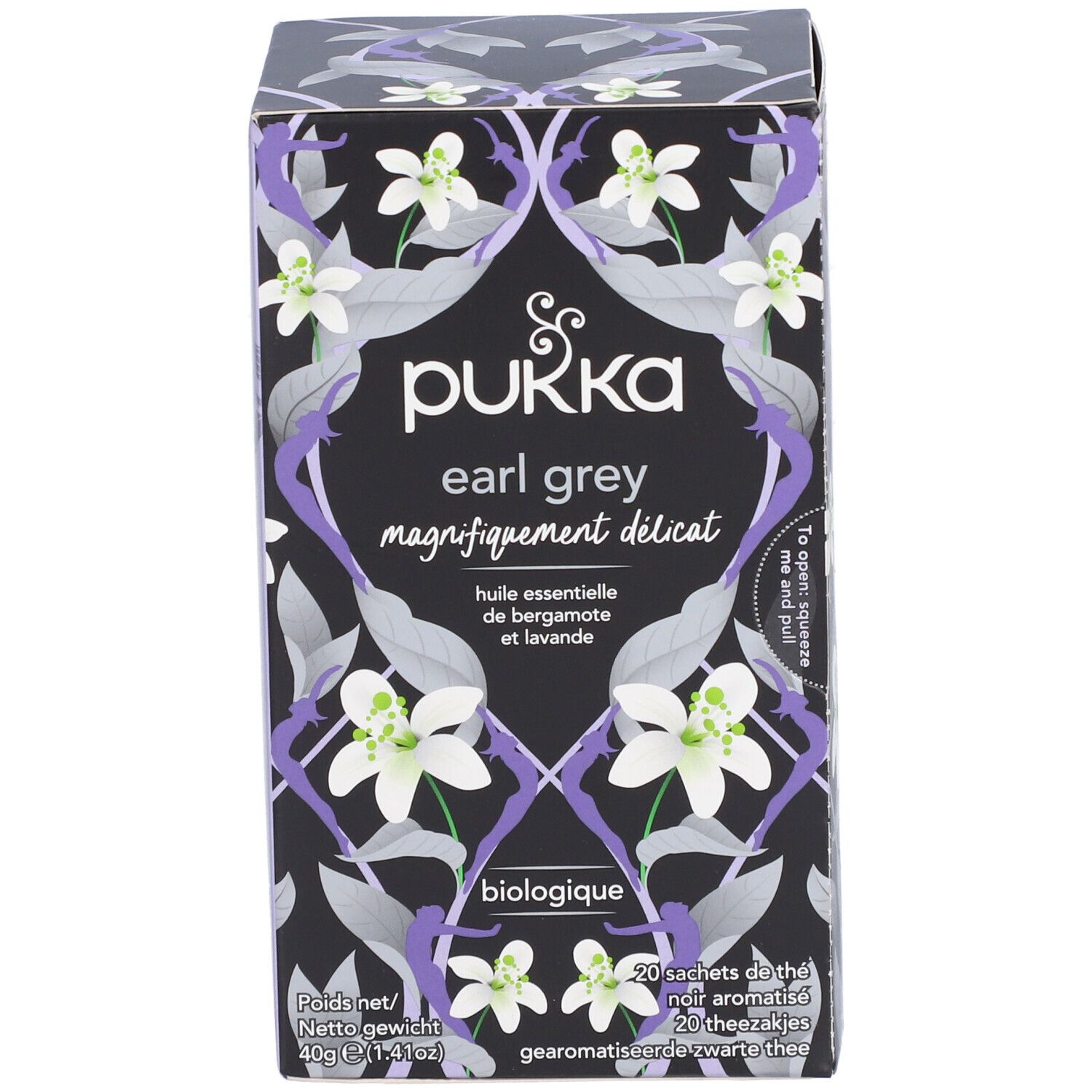 Boîte de thé Pukka Earl Grey. Fond noir avec motif floral et nom du produit. Biologique.