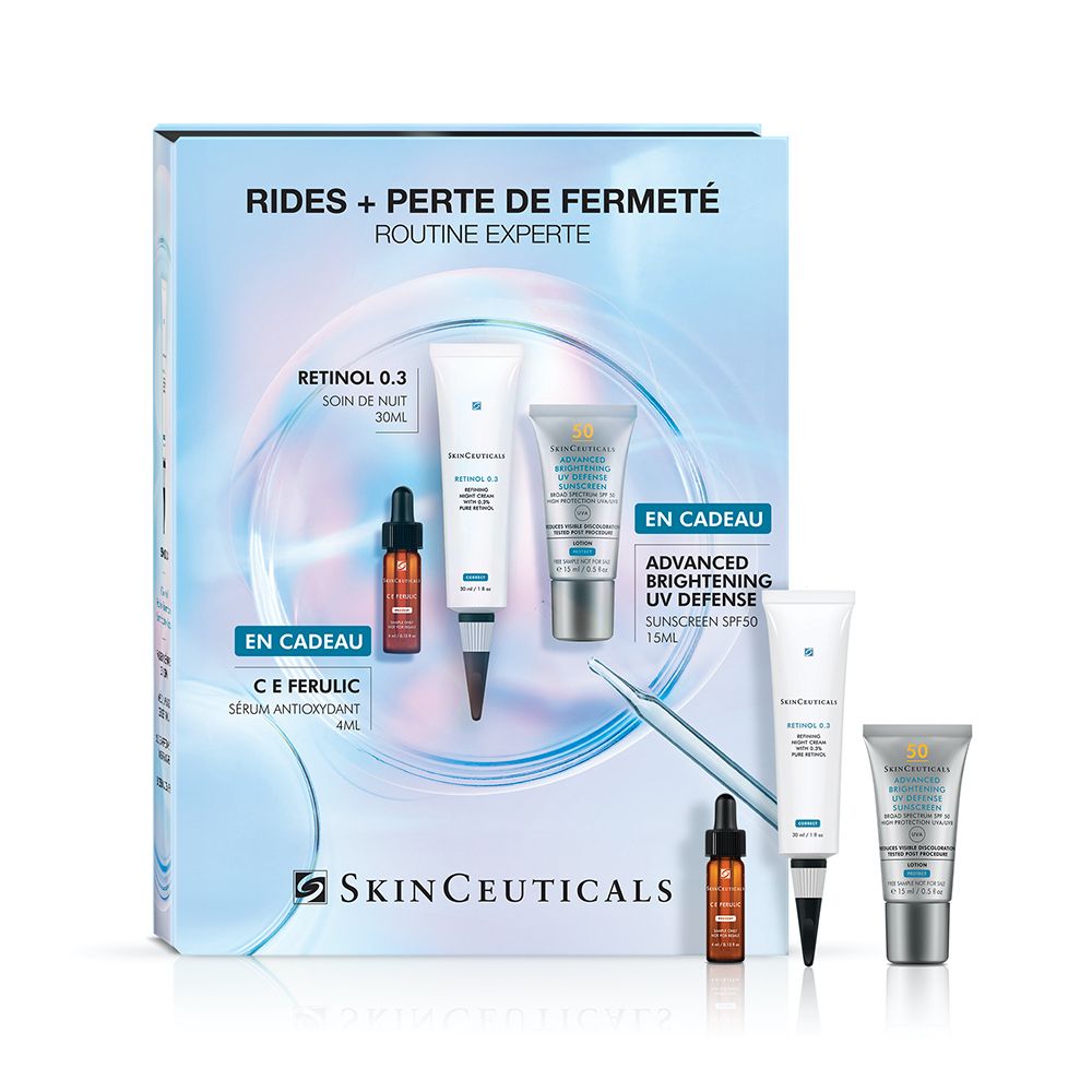 Coffret avec Retinol 0.3, sérum C E Ferulic et Advanced Brightening UV Defense. Logo SkinCeuticals. Fond bleu.