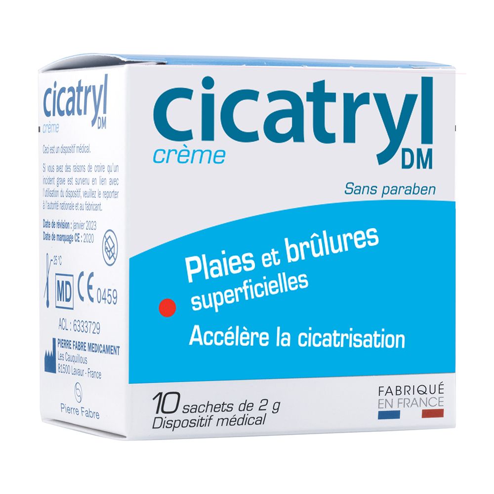 Boîte de crème CICATRYL. Emballage bleu et blanc. Contient 10 sachets. Dispositif médical. Texte : 'Plaies et brûlures superficielles'.