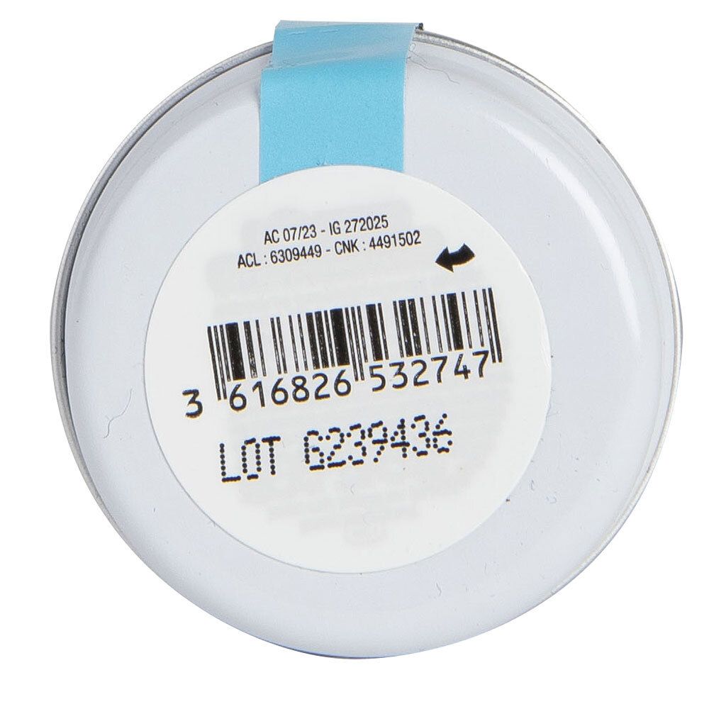 Boîte ronde, dos. Étiquette avec code-barres, numéro de lot et texte. Bande bleue sur le couvercle.