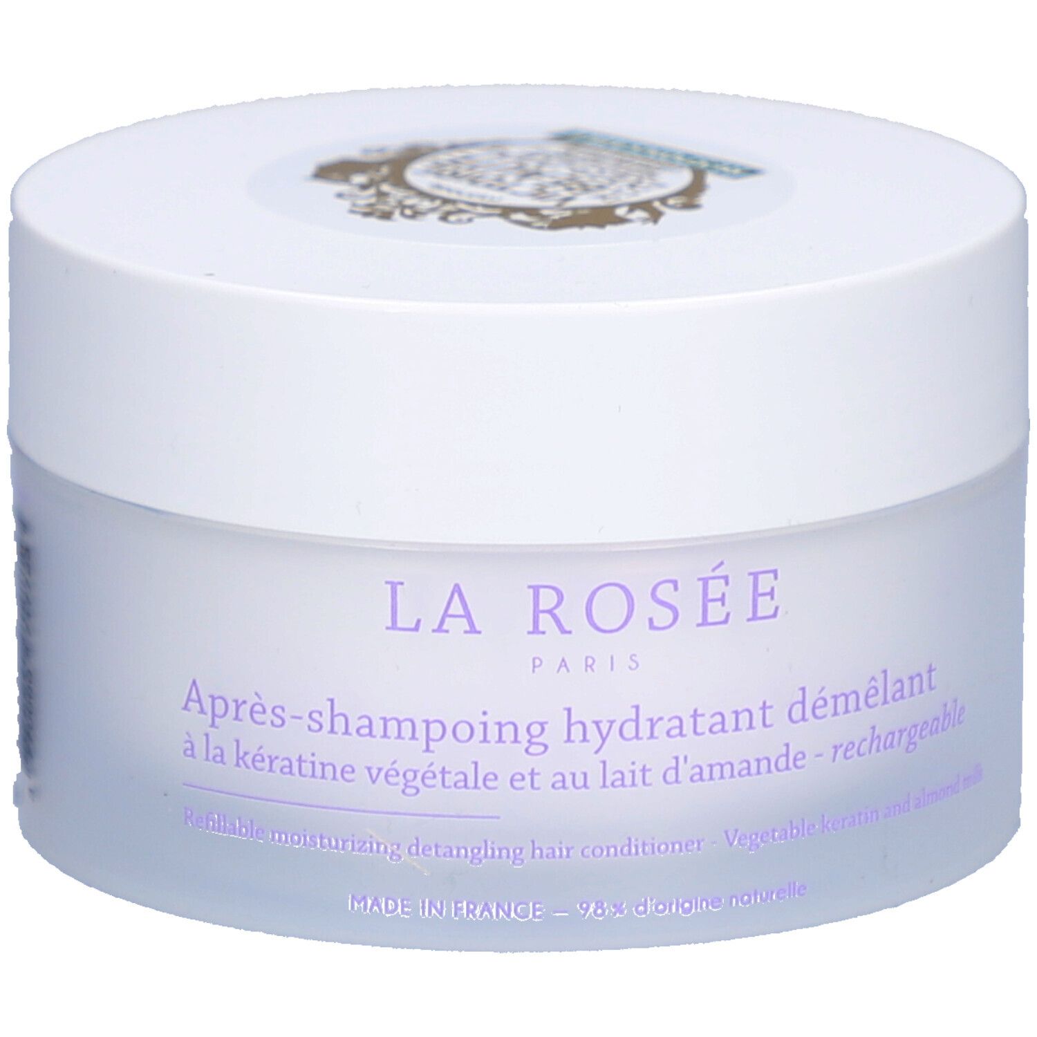 Pot blanc avec couvercle. Inscription : La Rosée Paris, Après-shampoing hydratant démêlant. Kératine végétale et lait d'amande.