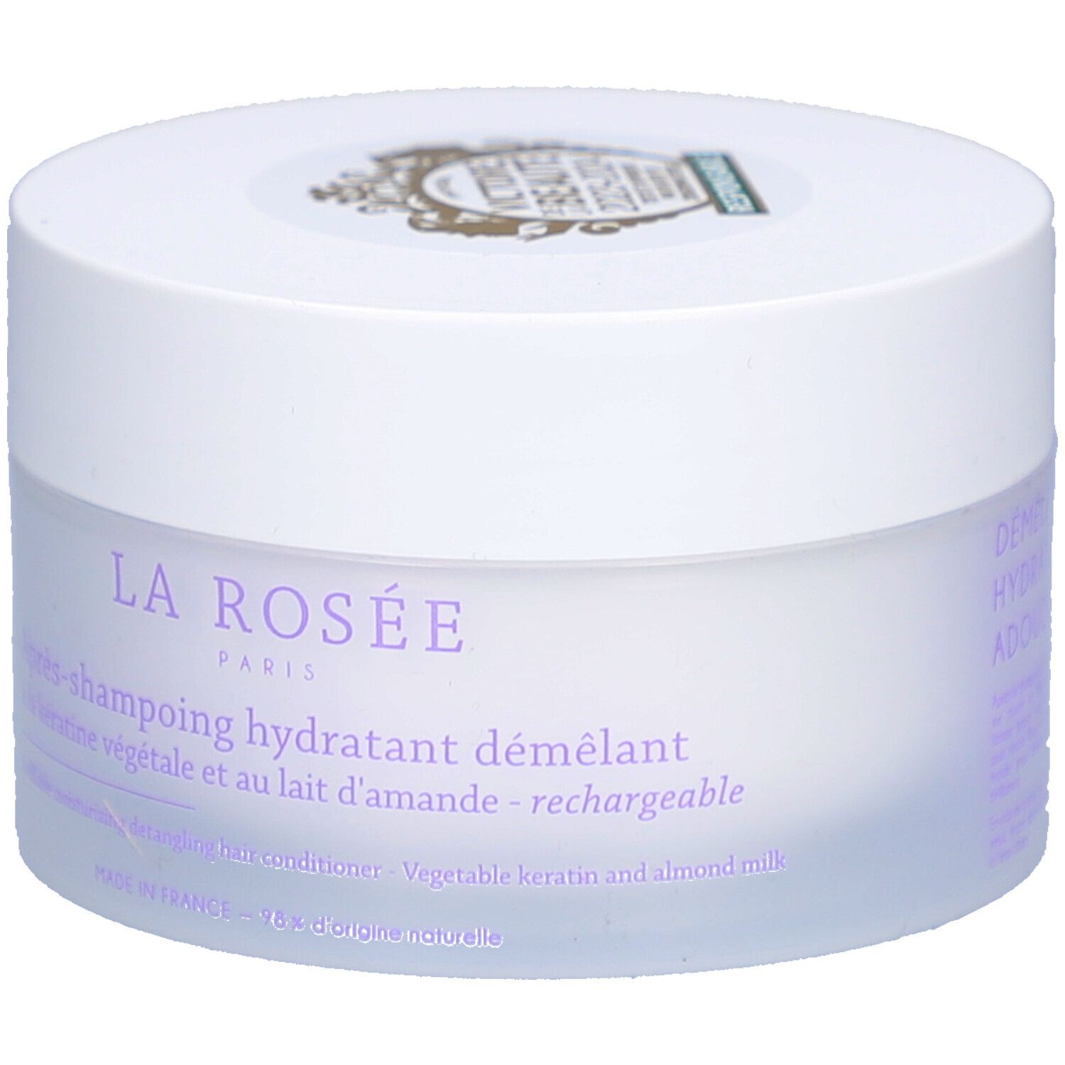 Pot blanc avec couvercle. Inscription : La Rosée Paris, Après-shampoing hydratant démêlant. Kératine végétale et lait d'amande.