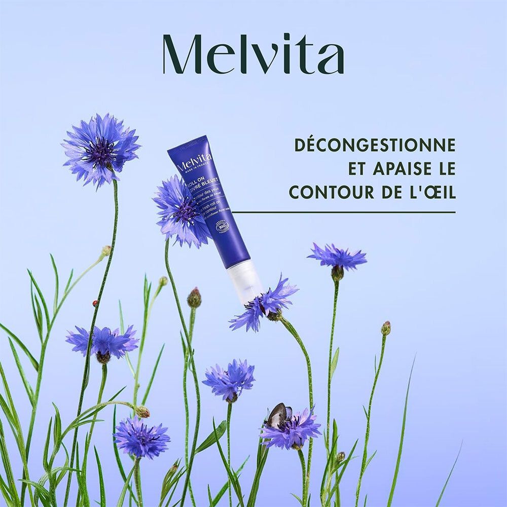 Roll-on Melvita à l'eau florale de bleuet parmi des bleuets.