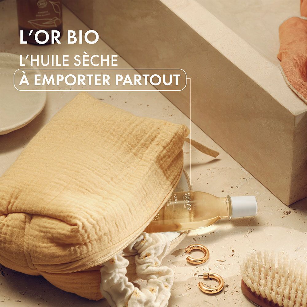 Flacon d'huile Melvita L'Or Bio dans un sac. Autres produits et accessoires.
